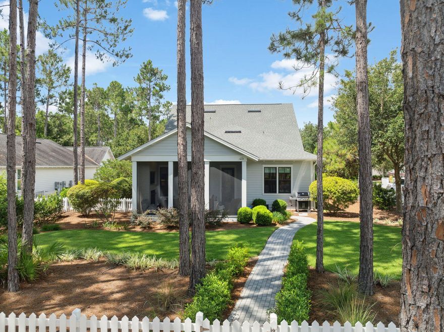 Situated on a prime oversized corner lot in the desirable Winter Garden phase at the front of Watersound Origins, 360 Jack Knife Drive offers a harmonious blend of coastal charm and thoughtful upgrades. This Huff Homes Coral Bean floor plan features four bedrooms--two on the first floor and two upstairs--ideal for maintaining privacy for family and guests alike.Built in 2015, the home has been significantly enhanced, including a renovated primary bathroom; swapped out the alcove tub (plumbing still available) for a window seat with added storage; Santorini blue marble tile adds a luxe accent throughout the space; fold down teak wall bench in the shower for space-saving convenience; new vanity wall cabinet provides perfect access to all grooming needs with his/her separation. Palecek designer lighting & California closet system complete the luxurious renovation. The bright beachy vibe is amplified by shiplap walls, distressed hardwood floors, and abundant natural light.The gourmet kitchen is equipped with quartz countertops and top-of-the-line Thermador appliances (installed2023) along with pull-out drawers in lower cabinets, a pantry, and a stylish dry bar with beverage fridge. The open-concept design flows seamlessly from kitchen to dining to living areas with custom lighting & Visual Comfort ceiling fans throughout.
Outdoors, the lushly landscaped backyard offers serenity and potentialwith ample space for a pool. Enjoy cozy evenings on the screened porch featuring a fireplace and TV.
Additional highlights:
* Located on a low-traffic street with adjacent park
* Garage system by Garage Experts with epoxy flooring, overhead storage, cabinetry, and slat walls
* Whole-house upgrades including water filtration, surge protection, Flow Tech system, and Kohler continuous clean toilets
* Wired for surround sound in the living room and TVs in all bedrooms
This home is a rare combination of privacy, upgrades, and locationperfect for full-time residents or second-home buyers seeking refined comfort in Watersound Origins.