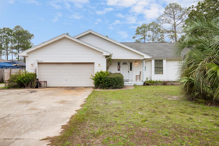 Don't miss out on this 3 bedroom, 2 bath home in highly coveted Holley By The Sea. This cute home is the lowest priced home in the neighborhood, priced to sell, and ready for a new owner! Nice open floor plan and plenty of room in the 2 car garage for all of your beach goodies. Quick hop, skip and a jump over the bridge to aquamarine waters and white sands of Navarre Beach. Enjoy the almost 1/2 acre lot and all the amenities that HBTS has to offer. Beach House style Recreation center is complete with 2 pools, 8 clay tennis courts, playground, weight room, and RV camping sites. Central to Hurlburt Field AFB and all of the shopping and restaurants that Navarre has to offer. Hurry! This one won't last!