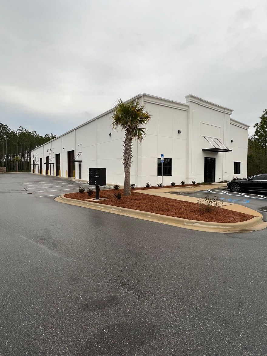 End cap unit in new Southern Riviera Business Plaza.  24' ceiling height, full HVAC, power roll up doors, 2 bathrooms, drinking fountains, epoxy floors.