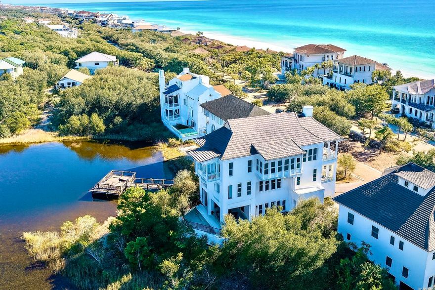 Welcome to an exceptional coastal retreat in the gated, non-rental community of Stallworth Preserve -- 68 Stallworth Blvd. This masterfully designed 3-story home, built in 2021, embodies refined beach living with sweeping views of the white sand beach and emerald green waters of the Gulf. As if Gulf views weren't enough, this gem is located on a coastal dune lake as well. Step inside to discover ~3,908 sq ft of living space highlighted by 5 spacious bedrooms and 7 baths (five full, two half). On the ground level you'll find a welcoming entry, laundry area, a two-car attached garage, and an amazing outdoor living area complete with a summer kitchen and a private pool -- all overlooking the serene coastal dune lake. Upstairs, four bedrooms each come with their own ensuite bath, offering privacy and comfort for residents or guests. The top floor is dedicated to living at its finest: a luminous living room, dining area, and gourmet kitchen  all arranged to maximize the stunning Gulf and lake views. Also on this level is an expansive master suite, making this the ultimate retreat space. This home combines beach house charm with modern amenities: double-pane windows, storm-ready doors, ceiling fans, a tankless water heater, and efficient electric systems. Outside, the property sits on an ~8,712 sq ft lot in a private, secluded enclave  with direct beach access located just across the driveway. A rare find in this prized 30A neighborhood. Whether you're seeking a luxury retreat, a coastal vacation base, or a high-end investment property, 68 Stallworth Blvd presents a rare opportunity  combining privacy, panoramic water views, and turnkey elegance, in a location that offers both serenity and access to the Gulf.

