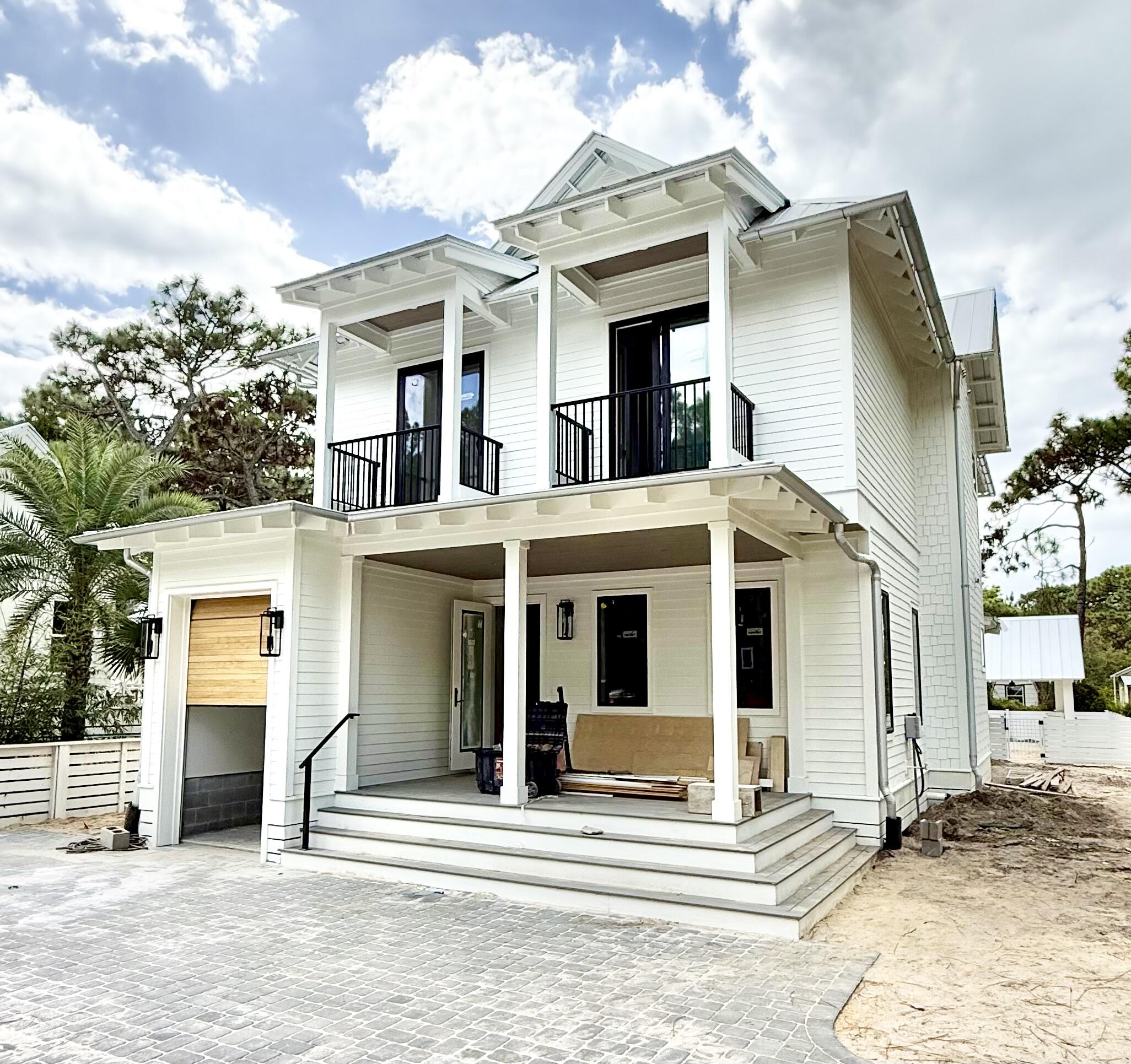 NOW offered Fully Furnished & turnkey! To be completed by November. Photos of finished home are of a similar plan. Welcome to 80 Chelsey Lane! Gulf Shore Manor is a non HOA deeded beach access neighborhood. Along with an abundance of outdoor living space, this well thought out custom home features two Master bedrooms, one on each floor. One of the five spacious bedrooms includes six built in bunks, four fulls and two twins. Cook your heart out on the 48 inch range or outside in the summer kitchen overlooking the pool and cabana. Brand new 6-seat golf cart to convey with acceptable offer. One year Builder Warranty also conveys.