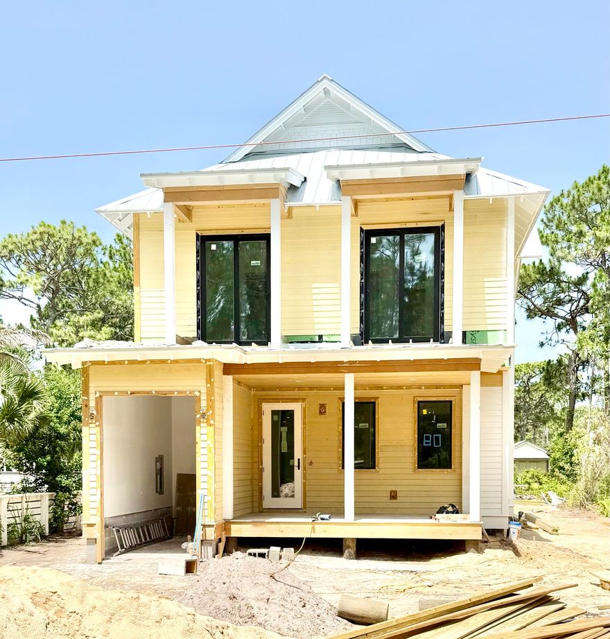 To be completed by November. Photos of finished home are of a similar plan. Welcome to 80 Chelsey Lane! Gulf Shore Manor is a non HOA deeded beach access neighborhood. Along with an abundance of outdoor living space, this well thought out custom home features two Master bedrooms, one on each floor. One of the five spacious bedrooms includes six built in bunks, four fulls and two twins. Cook your heart out on the 48 inch range or outside in the summer kitchen overlooking the pool and cabana.  Seller has a finished and furnished, similar house for sale one street over.