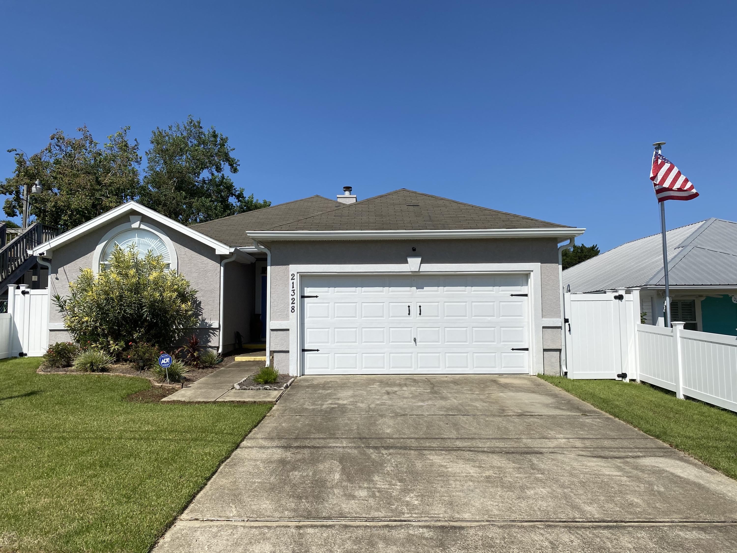4 bedrooms! Only 4 blocks to the beach in a golf cart friendly neighborhood! The current owners have never rented this home, but, it would be perfect for beach rental as it would sleep at least 8 and possibly 10! Upgrades include tile flooring, granite counters, new brick paver patio and a $10,000 vinyl fence. Flowing floor plan with open den, kitchen and dining areas including a wood burning fireplace! Full kitchen with all appliances, a laundry room with washer and dryer included! Lots of storage throughout and is being sold fully furnished (excluding one bed and owners personal items) but, including Alexa!.