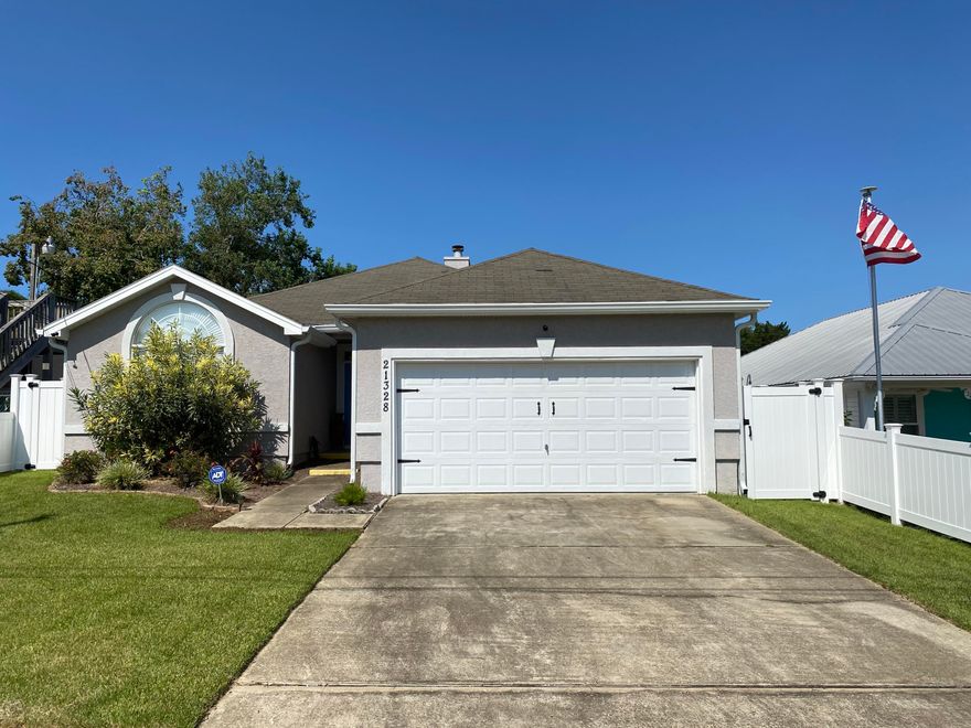 4 bedrooms! Only 4 blocks to the beach in a golf cart friendly neighborhood! The current owners have never rented this home, but, it  would be perfect for beach rental as it would sleep at least 8 and possibly 10! Upgrades include tile flooring, granite counters, new brick paver patio and a $10,000 vinyl fence.  Flowing floor plan with open den, kitchen and dining areas including a wood burning fireplace! Full kitchen with all appliances, a laundry room with washer and dryer included! Lots of storage throughout and is being sold fully furnished (excluding one bed and owners personal items) but, including Alexa!.
