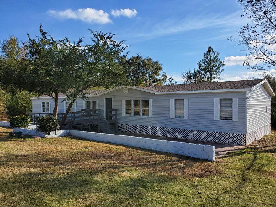 ADORABLE 4 bedroom 4 bath manufactured home for sale in Holt! This large home features fresh paint, new flooring, new appliances, new light fixtures, and more. BRAND NEW ROOF! Walk-in pantry, island in the kitchen, formal living room, formal dining room, breakfast nook, fireplace, and office with built in desk! Spacious bedrooms. Huge master with walk in closet and TWO BATHROOMS! Large 1.62 acre lot. Vacant and easy to show.