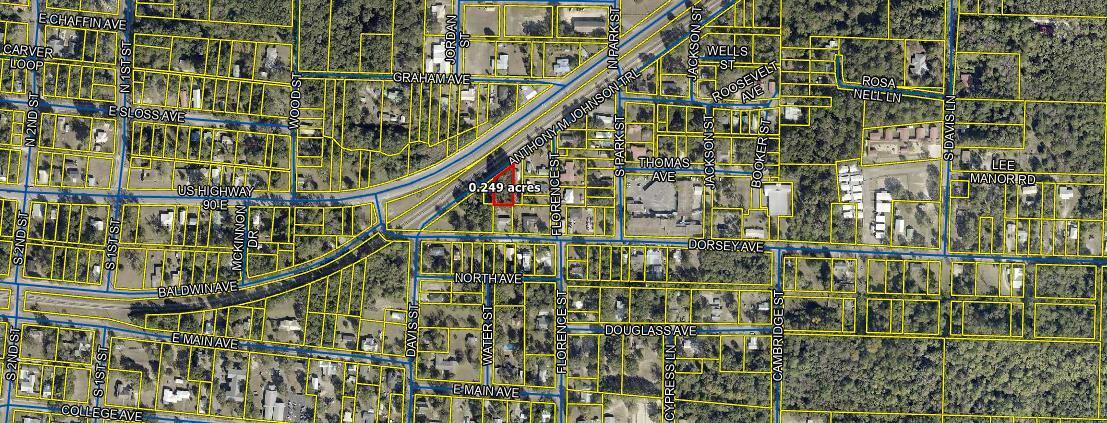 Great level buildable lot with quick access to Highway 90. Very close to the downtown area. .21 acres with utilities available. Tap fees have not been paid.