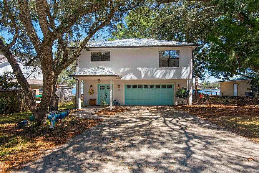 Waterfront Living in Fort Walton Beach - Where Every Day Feels Like a Vacation!This beautifully maintained bayou-front home is packed with updates and ready for you to move in and start living your coastal dream! All of the major systems have already been replaced, offering peace of mind for years to come:- Roof & gutters replaced in 2020- Brand-new dock (and boatlift) built in 2021 - perfect for fishing, launching kayaks, or watching the sunset- New seawall installed in 2022- Energy-efficient geothermal HVAC and water heater installed in 2023Step inside to a welcoming first-floor entry that features a private bedroom, full bathroom, and laundry room--ideal for guests, teens, or even a home office setup. From here, you'll enjoy easy access to the covered patio and attached garage, making everyday tasks a breeze.

Head upstairs to the main living area, where an open layout creates a bright, airy space that's perfect for entertaining. The kitchen, dining, and living areas flow seamlessly, with a large slider offers tranquil views of the water and lush trees lining the back of the bayou.

Step out onto the second-story deck, where your morning coffee comes with sunrises glistening on the water and evenings bring a front-row seat to dolphin sightings nearly every night.

Whether you're looking for a peaceful place to call home or a weekend escape on the water, this one-of-a-kind property has it all.