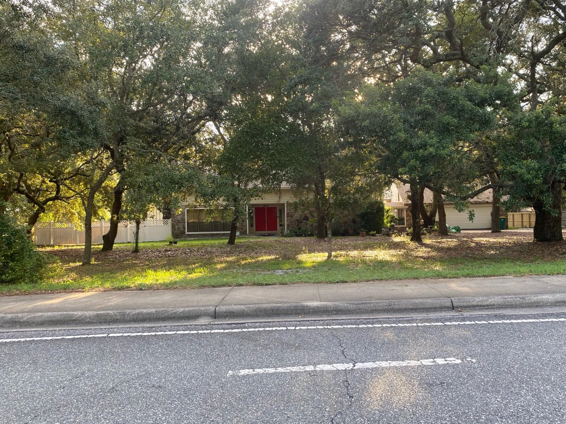 If you need a large home on an acre lot, then come see this 4 bedroom, 3 bath home with a pool in its own building, tennis court, and one bedroom garage apartment with full bath and laundry, for visitors / in-law quarters! Make your appointment, as of Friday, 8 August, as you'll enjoy this expansive home on an acre, with lots of extra storage! Have fun in the full sized pool in its own building, but attached to the home, with sun streaming in from the South, or enjoy playing on the tennis court! No HOA as you are in the county, so you can have chickens, as sellers did, for years! Home has many upgrades: New roof on house & garage '22, new roof on pool room, HVAC on main house, new motor for air handler, new tile downstairs and new LVP flooring upstairs! The hardwood... (please click MORE) cabinets were kept, but painted a light color to balance the dark wood trim. The 18" tile is at a diagonal to enhance the beauty. Besides the tile, the sellers upgraded the kitchen with quartz counters and a new breakfast bar! All 3 baths in the home were remodeled with new tubs and a shower, with the same quartz for the vanities! You have a patio to BBQ or sit in the sun and room enough to have a playhouse, with 4 long poles to build it on. A new header and spring was installed in the garage and you'll love how quiet the garage door opener (changed in '24 for a Genie) is. Be sure to see the complete list of upgrades in the attachment! If your business needs room for storage, you have room to add such on this huge lot! Home has termite bond with Rusty's Pest Control and quarterly bug spray thru June '26. You are one minute from the Mid-Bay Bridge entrance to Destin and the white sandy beaches of the Emerald Coast! White Pont Rd is closed in the summer (Noon - 6 pm on Saturdays) for those trying to get to Destin, so local residents can come and go more easily! Don't forget to call for your appointment! Seller is a licensed Realtor in Florida. Cheers!