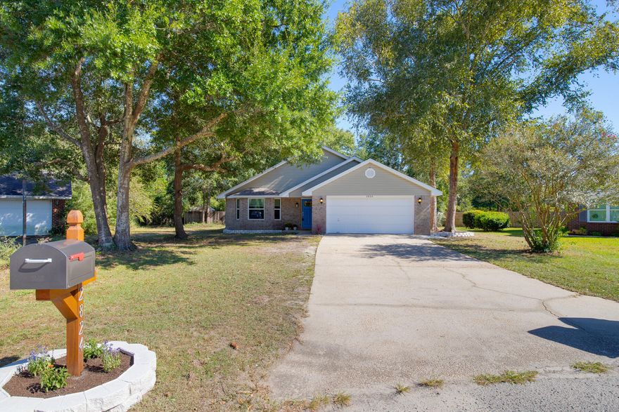 Welcome to 2824 Brassie Cir. This beautiful single level home features a bright open plan, fresh paint, new roof in 2021, new HVAC in 2020, and laminate wood flooring. Additional features include, security camera system, custom hurricane shutters, separate laundry room, large master suite, fully equipped kitchen, new dish washer and ceiling fans throughout. The kitchen opens to a large dining area and cozy family room with fireplace. Enjoy the peace and quiet of your large sunroom overlooking the home's large peaceful private lot equipped with sprinkler system, separate storage building, and surrounded by a wood privacy fence.  Call today for your private showing of this beautiful Navarre home.