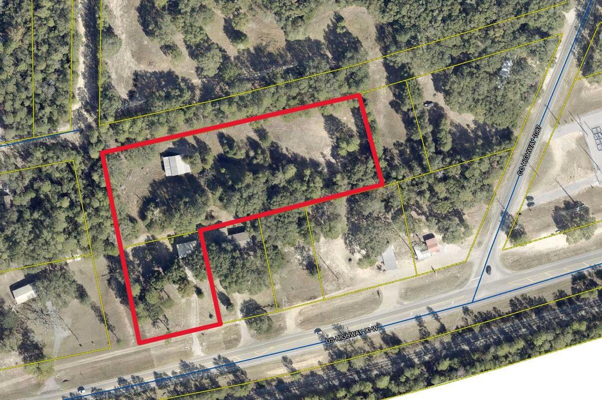 Almost 3.5 acres located on Hwy 90 West near the intersection of County Hwy 1087. Tons of potential to rezone or use as is. Currently there is an occupied small brick home on the property in good condition that could possibly be used as an office and a pole barn in the back. Area is growing at a rapid pace and this is a prime location for several different types of ventures. Only minutes from the Mossyhead Industrial Park and Blackstone Golf Course. Property has unopened platted roads on the West and North sides for even more options. Excellent opportunity for someone needing a home business with Highway exposure.