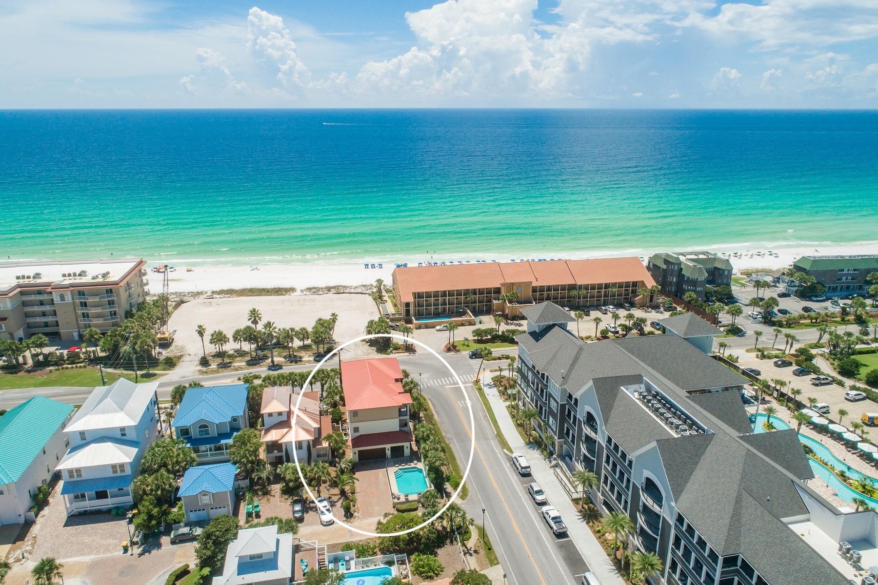 Exemplary opportunity to own this masterfully built second tier coastal retreat prominently presiding over beautiful gulf views in the heart of Crystal Beach at the corner of Matthew Blvd and Scenic Highway 98 adjacent to the world class Henderson Resort and Spa as well as walking distance to premier beach access. This sprawling seven bedroom home is an impressive and established short term rental with over $148,000 gross income already generated YTD 2018 with projections for 2019 exceeding $165,000. Notable features include turn-key professional coastal decor, ample parking as well as a two car garage, spacious pool area and adjoining pool deck accessible from the covered outdoor living area, private commercial-style elevator offering easy access to all three stories as well as covered