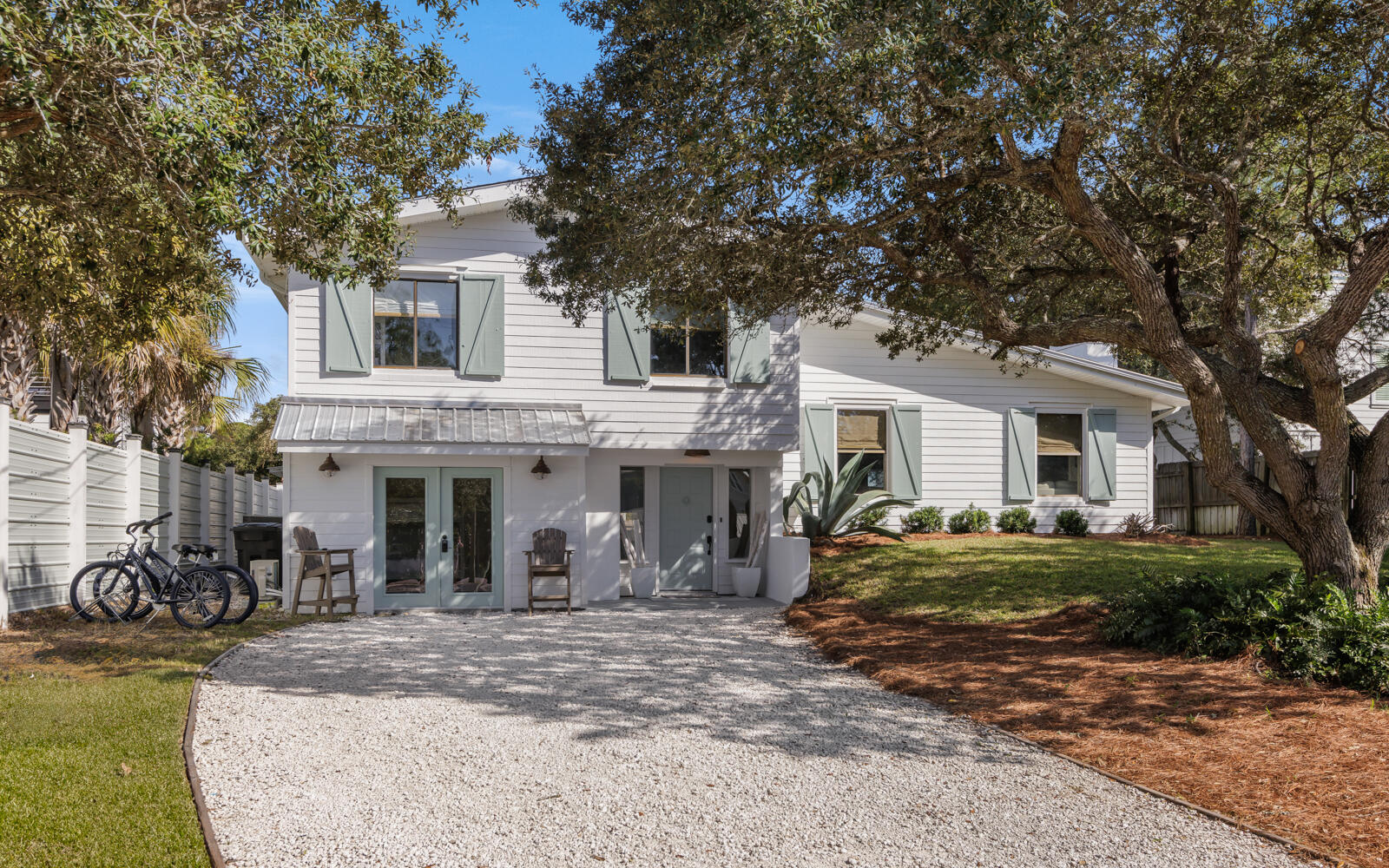Welcome to your dream coastal retreat! This beautifully renovated 4-bedroom, 2.5-bathroom home, updated in 2022 to include an electric car charger, is a rare gem offered fully furnished and rental ready. Nestled on a spacious 0.22-acre lot, this property has room for a private pool and is projected to generate over $150,000 in gross rental income with the addition of a pool, making it an ideal investment opportunity.Imagine the possibilities with this versatile property. Whether you choose to enjoy it as is or clear the lot for a custom build, the potential for stunning gulf views from a third-story balcony is within reach. Located within 0.2 mile from the nearest beach access, this home offers the perfect blend of relaxation and convenience.