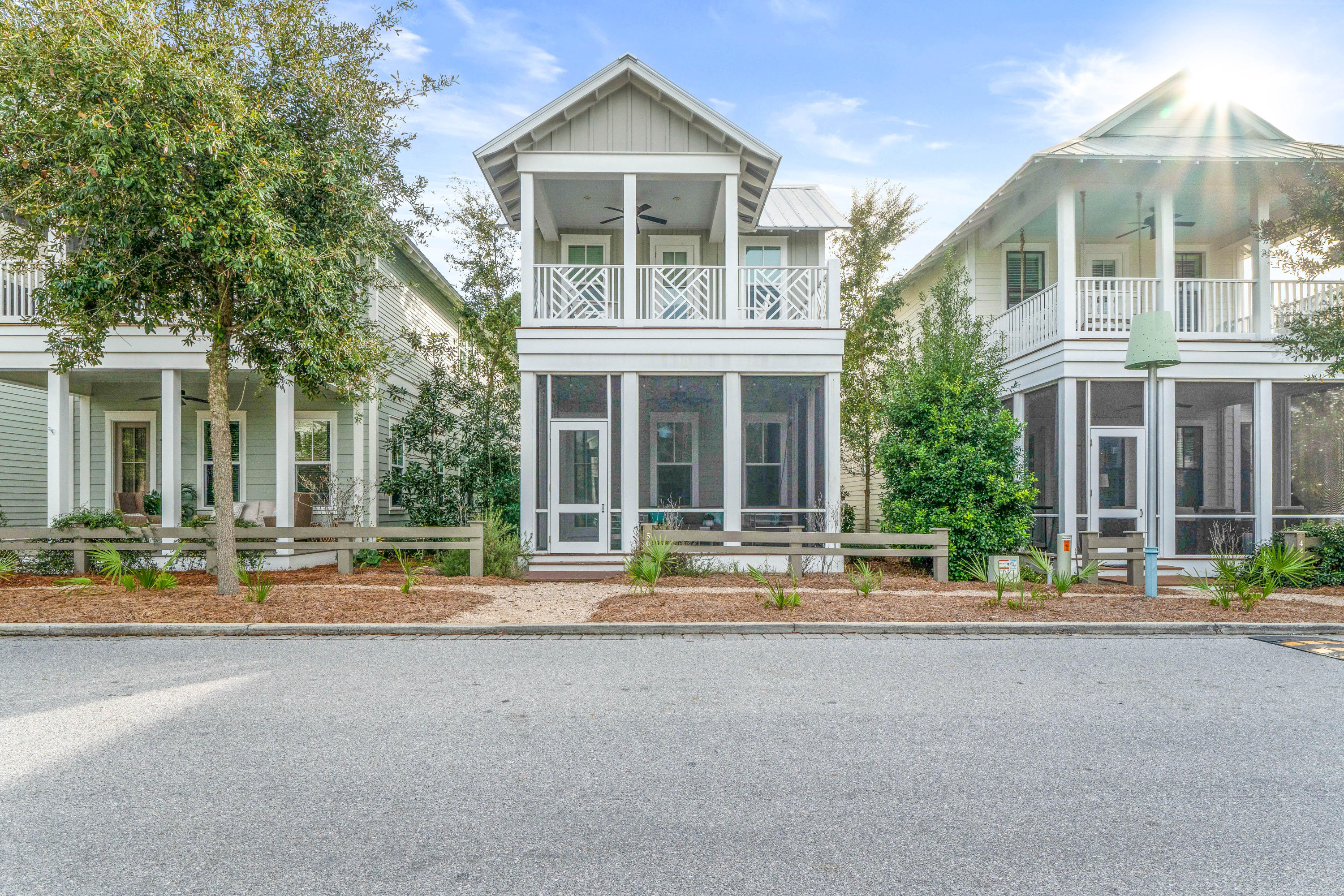 This Watercolor Turn-Key, Open Concept 5 Bedroom/ 4.5 bath, well-appointed home is conveniently located in the Crossings District. It sits just steps away from the DragonFly Pool. It is perfect for a Primary, Secondary or Vacation Rental Investment home! Plus the newer Golf Cart is included with an acceptable offer! This spacious home with generous ship-lap and all hardwood floors throughout, grants loads of flexibility. Enjoy 1 master with en suite on the main level and 2 upstairs, plus 2 bunk rooms. Unwind on the spacious & comfortably furnished screened downstairs porch, then come inside to the inviting & open living, dining, bar and kitchen areas. Grab a drink, a book & retreat to the 2nd flr open and airy porch, just through the largest Master with beautiful en suite bath.