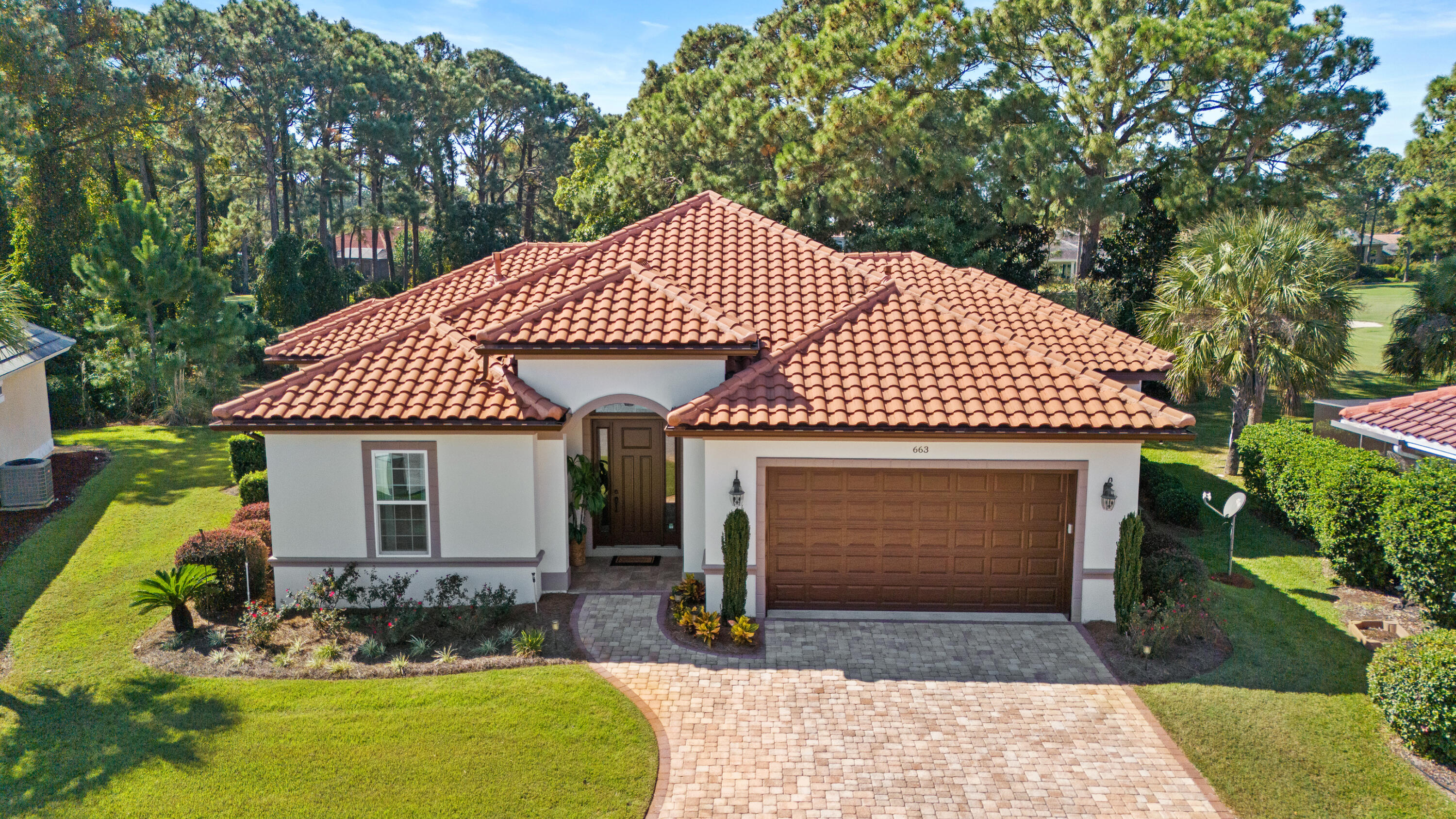 Welcome Home to Emerald Bay! Golf course-front living and privacy seamlessly combine in this custom-built home. This ICF home (concrete construction) features three generous sized bedrooms, four full bathrooms and a large office. The south-facing heated salt-water pool and welcoming lanai have been meticulously maintained. The private yard faces the 4th hole of the Emerald Bay Golf Course and mature magnolia trees lend an air of privacy and tranquility. The screened-in pool and lanai also have an enlarged pool deck and patio for entertaining and enjoying the coastal lifestyle. This open concept home with gas fireplace, tankless hot water heater, alarm system and central vacuum system all lend to the ease of Florida golf course living. Contact your Realtor today for more detail!