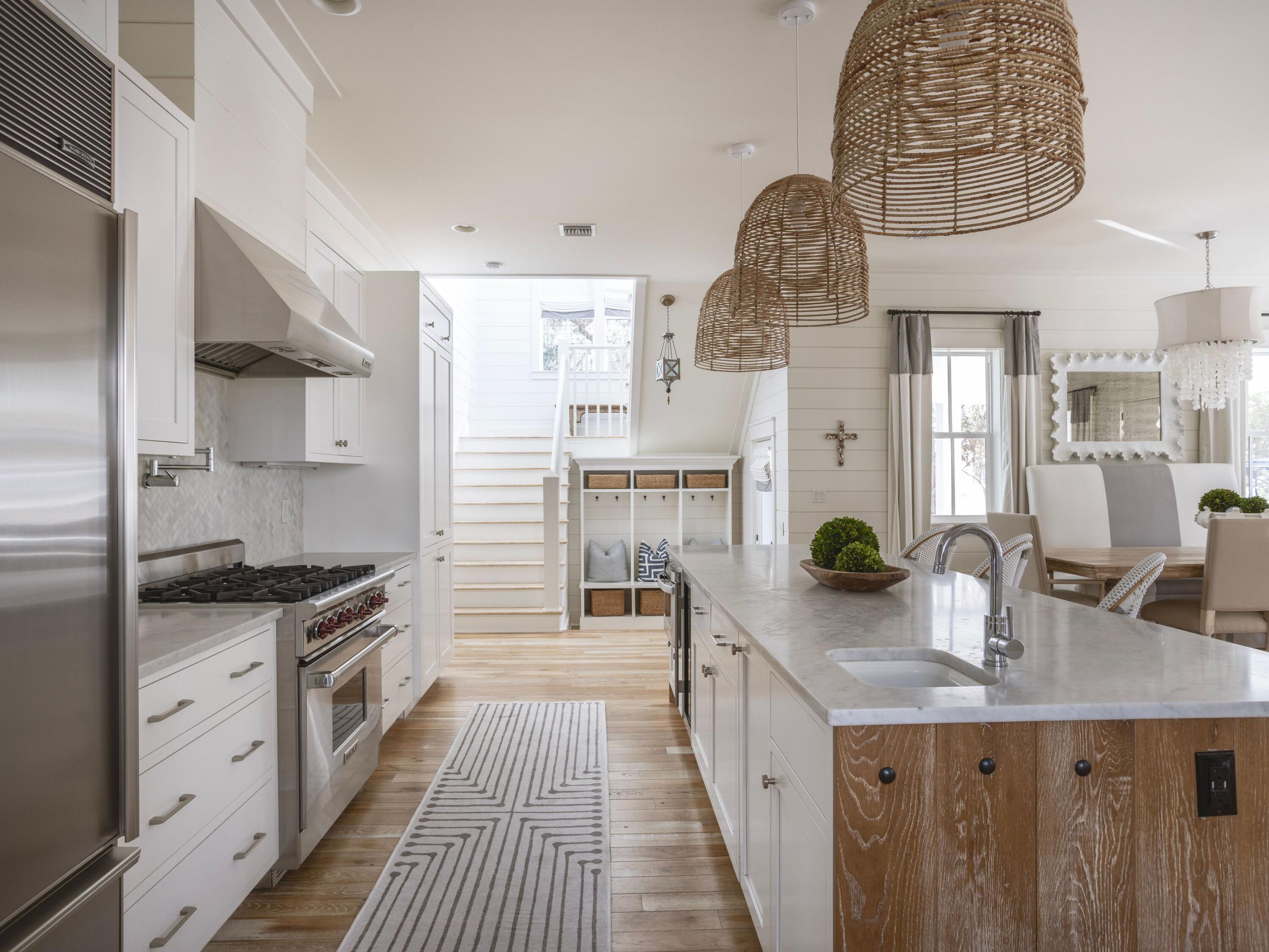 This exquisite Southern-style cottage is a masterpiece of refined elegance and effortless luxury, nestled within the prestigious WaterColor community. Thoughtfully designed for both relaxation and entertaining, the home's inviting front porch, shaded by lush greenery, sets the tone for a lifestyle of comfort and sophistication. Step inside to discover gorgeous hardwood floors, abundant natural light, and an impeccable open-concept living space that seamlessly blends style with function. A spacious dining area and wet bar provide the perfect setting for gatherings, while the gourmet kitchen, adorned with pristine white cabinetry, sleek countertops, and top-tier stainless appliances, offers an ideal space to prepare and enjoy coastal-inspired cuisine. Beyond the interiors, this home invites you to experience the beauty of outdoor living. The screened-in back porch, with exposed beams, rustic flooring, and a cozy fireplace, creates a serene retreat for unwinding with a glass of wine or watching your favorite show under the stars. A tranquil patio is perfectly suited for alfresco dining, while an outdoor shower offers convenience after a sun-soaked day at the beach. The four beautifully appointed bedrooms include a first-floor suite with an oversized ensuite bath, featuring a soaking tub and walk-in shower, and a luxurious master suite on the second floor with private porch access and a spa-like master bath. Additional updates include a redesigned first-floor master suite, an upgraded laundry room, and an enhanced half bath.

Practicality meets luxury with a side carport that includes a six-seater golf cart, providing added convenience for exploring the WaterColor community. A paved driveway offers ample parking, ensuring ease of access for you and your guests.

Living in WaterColor means access to an unparalleled array of world-class amenities, including resort-style pools, championship tennis and pickleball courts, an exclusive Beach Club, and the lazy river at Camp WaterColor. Nature lovers will appreciate paddleboarding on Western Lake, scenic hiking trails, and access to the sugar-white sands of 30A. With boutique shopping, gourmet dining, and endless coastal adventures just moments away, this exceptional residence offers the ultimate blend of privacy, sophistication, and the quintessential WaterColor lifestyle.