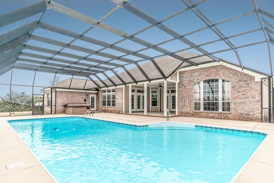 Golf community with a private pool! Welcome home to your 3,339 sf retreat! There is nothing small about this 4 bedroom 3.5 bathroom home backs up to the 14th hole in the private gated community of Windswept Estates. This home features 10 ft ceilings, a huge master suite, and a 20X40ft screened in swimming pool in the back. Inside you will find counter space galore in your gourmet kitchen, which includes granite counter tops, stainless steel appliances, and a gas cooktop. This home also includes, not one, but two living areas so everyone can watch what they want on tv. Windswept Estates is a beautiful golf course community featuring a community pool, tennis courts, and much more. It truly is a must see! Call today for your private showing.