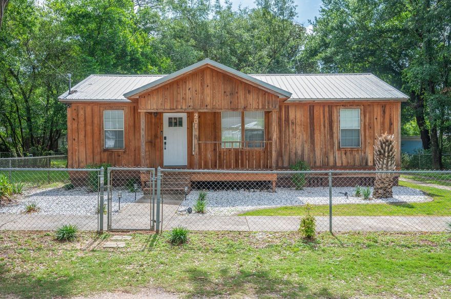 WELCOME to this completely refreshed two bedroom, 1.5 bath cottage! This cozy home has been completely remodeled since 2021. The effective age of the house has been updated to 2020 on the property appraiser site. New plumbing, wiring, siding, metal roof, HVAC, sheetrock, ceiling treatments, lighting, countertops, bathroom, LVP flooring, deck, landscaping... you name it... no detail overlooked! Make an appointment to see this beauty today!