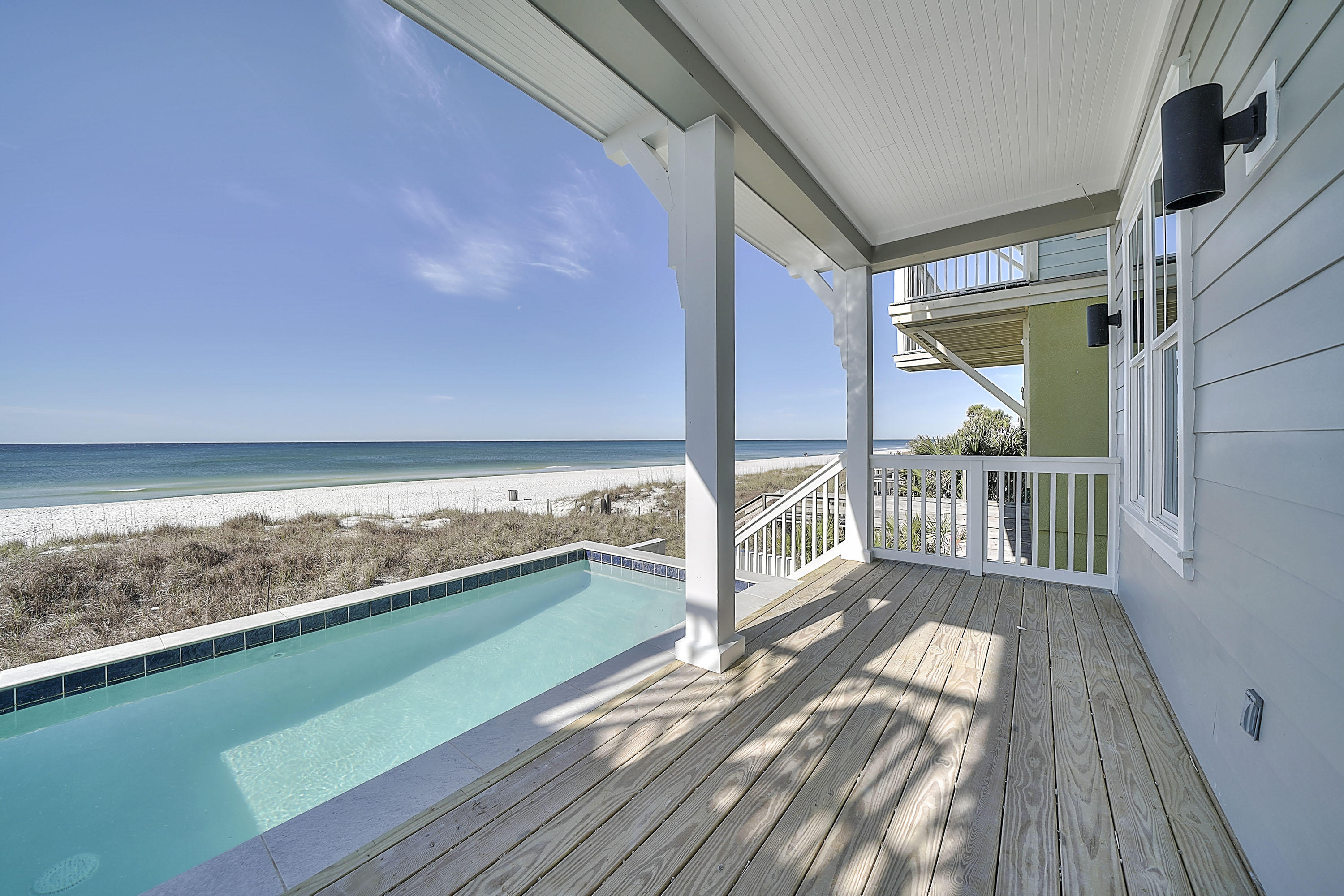 Price REDUCED!! Buy now before Summer Rental Season!! CONSTRUCTION NOW COMPLETE!! GULF Front 3-story home in Laguna Beach with POOL, ELEVATOR and attached garage. This home features 5 bedrooms and 5 1/2 baths, 2832 sq ft total with balconies off the 2nd and 3rd floor and covered porch on 1st floor leading out to the gulf front pool. With porcelain tile flooring throughout the home, recessed lighting, crown molding, custom closet shelving, solid core interior doors, quartz countertops, Rinnai tank-less water heater with recirculating loop and porcelain tile showers & tub surrounds - this home is absolutely gorgeous. ***Amazing gulf front home - West Panama City Beach and under $2M! Contact your Realtor today to come take a look