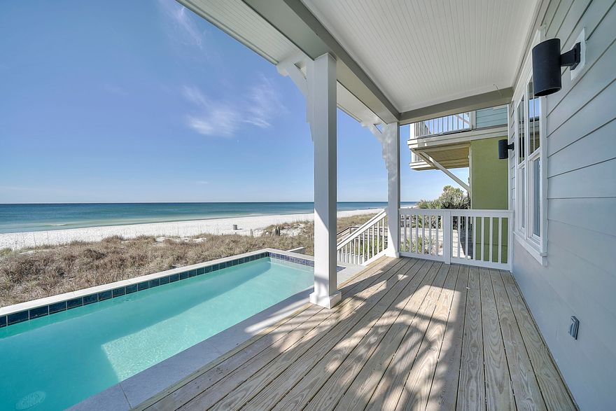 Price REDUCED!! Buy now before Summer Rental Season!! CONSTRUCTION NOW COMPLETE!! GULF Front 3-story home in Laguna Beach with POOL, ELEVATOR and attached garage. This home features 5 bedrooms and 5 1/2 baths, 2832 sq ft total with balconies off the 2nd and 3rd floor and covered porch on 1st floor leading out to the gulf front pool. With porcelain tile flooring throughout the home, recessed lighting, crown molding, custom closet shelving, solid core interior doors, quartz countertops, Rinnai tank-less water heater with recirculating loop and porcelain tile showers & tub surrounds - this home is absolutely gorgeous.  ***Amazing gulf front home - West Panama City Beach and under $2M! Contact your Realtor today to come take a look