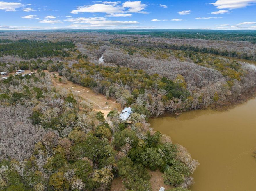 Welcome to your own slice of paradise on the Choctawhatchee River! With 49+/- acres of stunning natural beauty, this property offers endless possibilities for both relaxation and development. Picture yourself casting a line into the river, surrounded by the soothing sounds of flowing water and the shade of majestic Cypress and Oak trees that have stood tall for over a century.While this property is the perfect place to call home, it also presents an exciting investment opportunity. With a Planned and platted 44 lot subdivision already in place, along with almost 8 acres of commercial property, you have the chance to create something truly special.