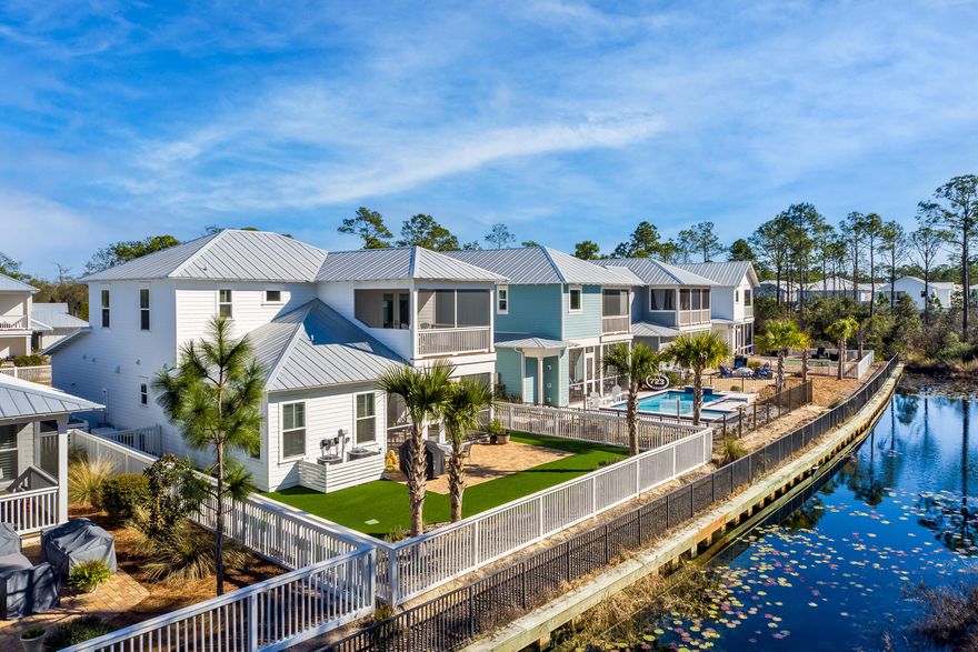 NATUREWALK AT SEAGROVE. 3,059 SQFT. 4 bed 4.5 bath. home In immaculate condition. The front of the home has a garage and paved parking leading up to the broad porch and entrance. Four porches on various levels deliver 700 square feet of space for those who enjoy an outdoor lifestyle. Inside, the foyer opens into a family room revealing plenty of well-ordered space beneath deep coffered ceilings.  French doors lead out from the living room onto a delightful private paved terrace and grilling area. Laid out with pavers and Astroturf, the backyard is zero maintenance making it the ideal second home or full-time residence. New generator. Furniture in the photographs are for illustration purposes only the home is sold unfurnished.