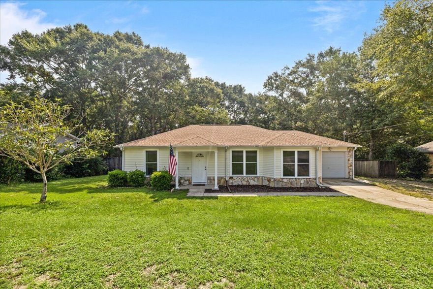 Come and see this move-in ready home in the desirable South Crestview area. This charming home features a split floor plan with new LVP flooring in the common areas and new carpet in the bedrooms. The upgrades don't stop there - new windows and a sliding glass door have been installed, along with fresh paint, light fixtures, and new ceiling fans. The kitchen has also been updated with new cabinets, and a new roof was installed in 2018. You'll love spending time in the spacious yard, perfect for outdoor activities and entertaining. Don't miss out on this fantastic opportunity to own a beautiful home in South Crestview.