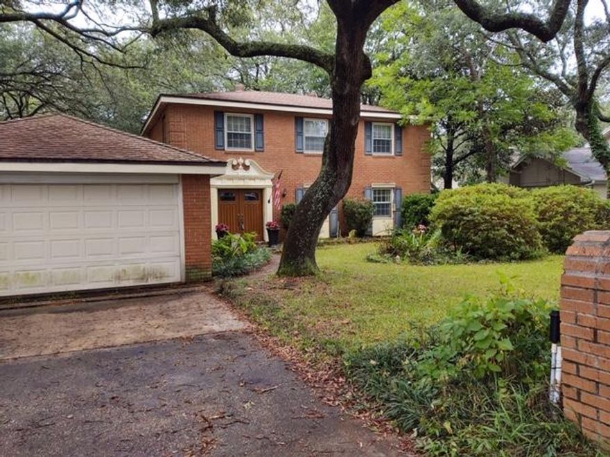 A very unique Home - The Quality of its Day is still quiet evident! 5 bedrooms, and one is huge, 3.5 Baths. Upstairs is a Master Bedroom with private Bath, and 3 other bedrooms including the large one. Full Guest Bath is quiet large. Vanity tops are simulated marble. Downstairs is a Master Suite with a large full bath, and a half bath in the foyer. Flooring upstairs is SOLID REAL Oak flooring in good condition. Downstairs is a combination of Wood, Laminate and Quarry Tile. TheKitchen Cabinets are made of SOLID Black Walnut from Germany - The counter tops are solid surface. A unique feature is a rolling Round Bar with storage beneath!Window frames are Wood, in very good condition with storm windows over. The Den has a large fireplace with gas logs. Owner was a MASTER