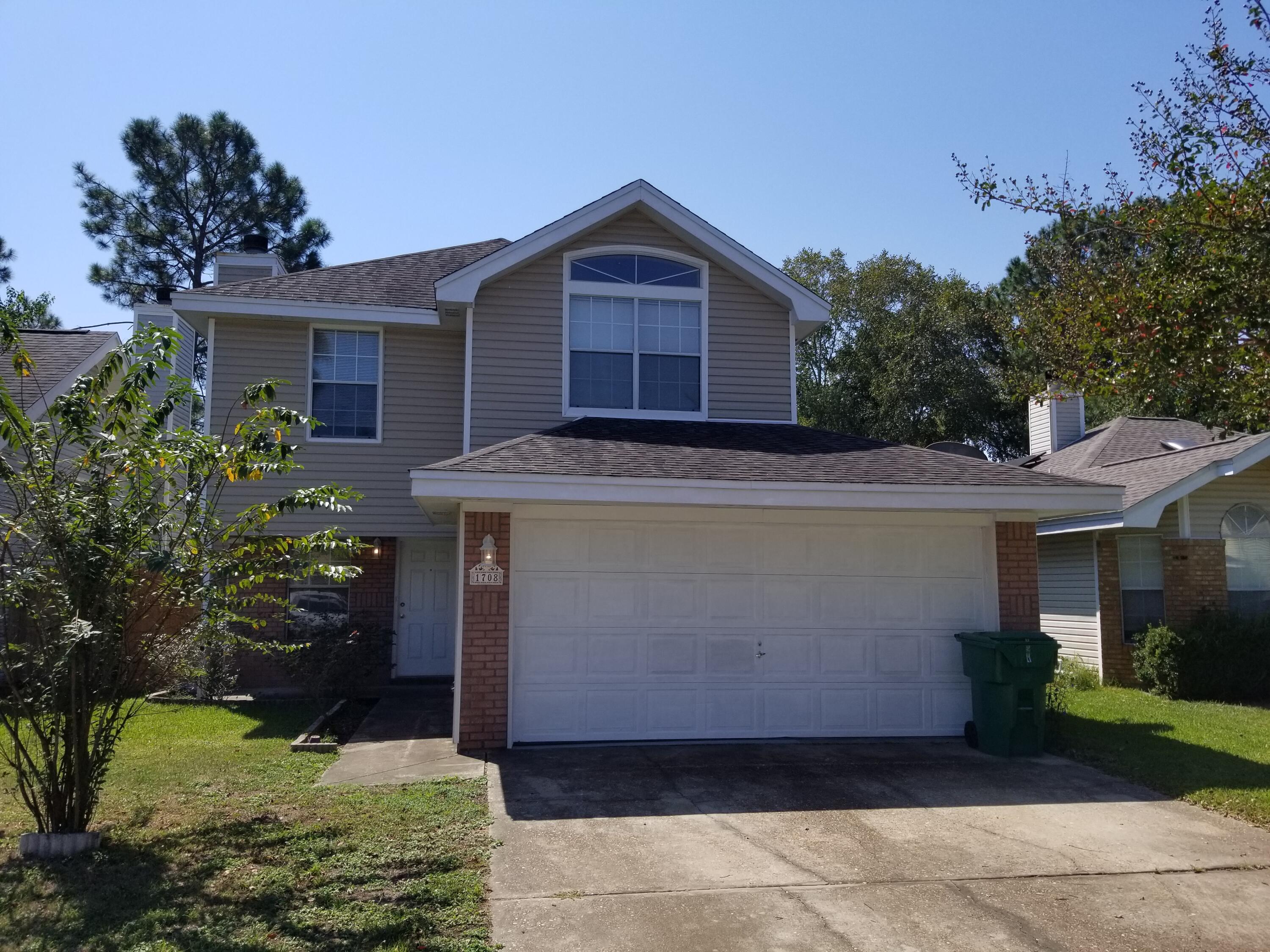 Waterfront 3 bedroom/ 2.5 bath home in  Lake Charleston. The location of this home affords owners with quick access to shopping, dining and beaches and is less than 30 minutes to 7th Group, Duke Field, Hurlburt, and Eglin AFB. This home has beautiful unobstructed lake views from the living room, kitchen and deck. Floor-plan includes vaulted and trayed ceilings, fire place, laminate and tile in main living areas and bathrooms. Additional features include interior and attic storage areas, whirlpool tub, privacy fence and exterior storage unit. Updates  completed are A/C vents (06/22), upgraded vinyl siding/insulation (09/16), HVAC (08/2014). The garage was partially enclosed to create additional finished living area and can accommodate a car with additional space for storage.