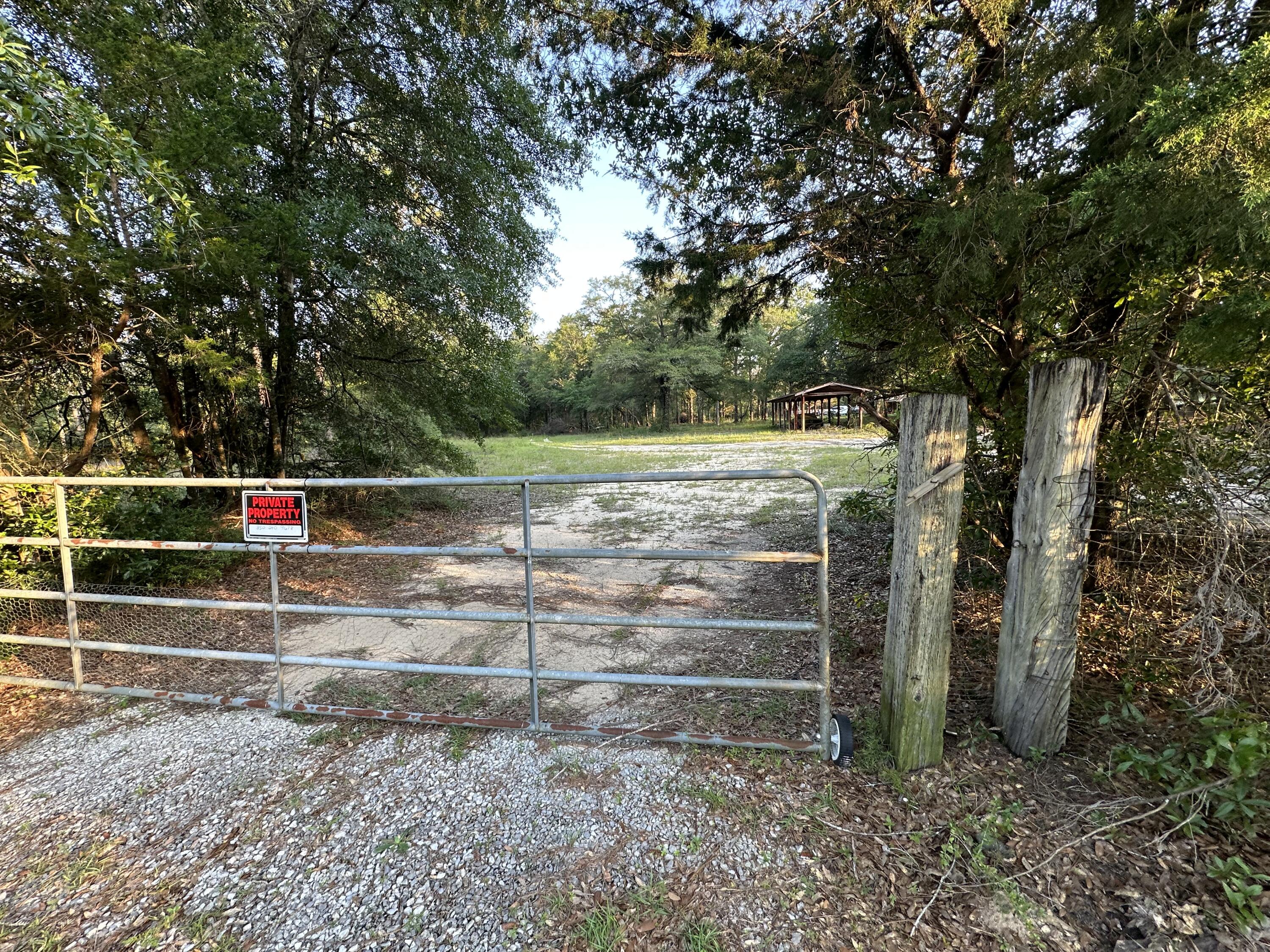 Its time to settle down! Bring your build plans today! Cleared out front with power and water available!This 10+/- Acres of Prime Land has about 170 Ft of road frontage and is county zoned as Agricultural. Easy access to Hwy 393, Hwy 188, and hwy 85 giving various options for local Beaches, shopping centers and restaurants.