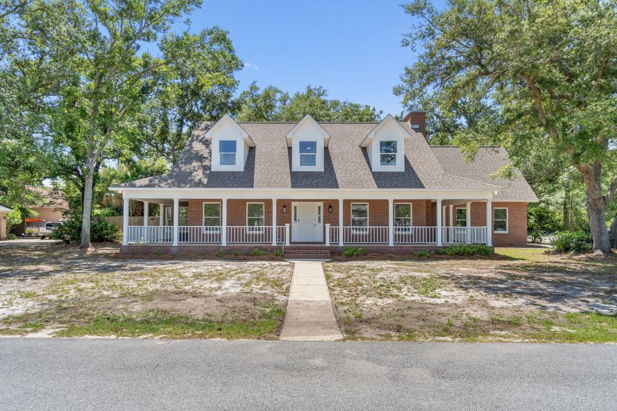 Waterfront living without the Waterfront price!! This gorgeous home is full of charm and character from the moment you step onto the wrap around front porch. A really exciting feature of this property is the 20'x130' parcel directly across the street that gives you private access to the canal that will take you right out to the Intercostal Waterway/Sound. Perfect for dropping in your kayaks, paddle boards or installing a jet ski lift! The interior has been remodeled with new fixtures, flooring, paint, completely renovated kitchen w/quartz countertops, soft close cabinets and stainless appliances. Enjoy the southern charm throughout, from the wrap around windows, a bay window breakfast nook and the cozy brick fireplace in the living room with built ins. Closets galore throughout the home! Make your way upstairs to the bedrooms and a large Bonus Room, perfect for a media room or game room. All bathrooms feature new tile surrounds, countertops, vanity mirrors, lighting and hardware. Another great feature I love about this home is the laundry shoot from the upstairs bathroom!  Enjoy those Florida nights in your very large 507sf screened porch. The yard has so many beautiful oaks that adorn the design of this home, that you won't want to miss out viewing this beautiful and unique property. Call uour agent today to schedule a private showing.