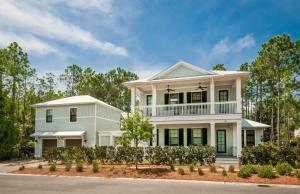 Never rented, very private Watercolor residence with 5 bedrooms, 5.5 bathrooms, a bunk room and a guest retreat over the 2+Car garage.  Conservation land to the South, a park adjacent to the North and a vacant lot across the street make this home feel spacious and secluded, an exception in Watercolor. Be sure to look at the 3D Interactive Matterport Virtual Tour in the photo section of this listing.  A covered porch leads to both the entryway and a wraparound open-air deck for soaking up the bright Florida sunshine while relaxing on the huge porch swing.  As you enter the house there is an open concept family, dining and kitchen area, a powder room for guests and a bedroom with en suite bathroom. This bedroom would be the perfect private office for those working from home.