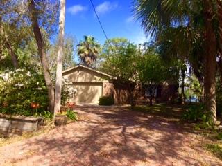 Priced to sell... Lots of renovations and custom upgrades in this beautiful home. 264 ft. of a sink for fish cleaning etc. Gunite pool is enclosed with screen lanai, keeping out bugs and leaves. Master bedroom overlooks the pool and the Bayou. Truly a fascinating place to live. Convenient to Sacred Heart Hospital, Grand Blvd. w/Publix, great restaurants, shops, offices and movie theater. There are mature trees and plants in the yard attracting several species of birds. Office and separate bunk room on the main level. extra stove and kitchen cabinets in the garage. Storage building detached. No hassles with HOA's. Very short drive to beaches. Great Schools. VERY PRIVATE. Back yard is fenced except watersi