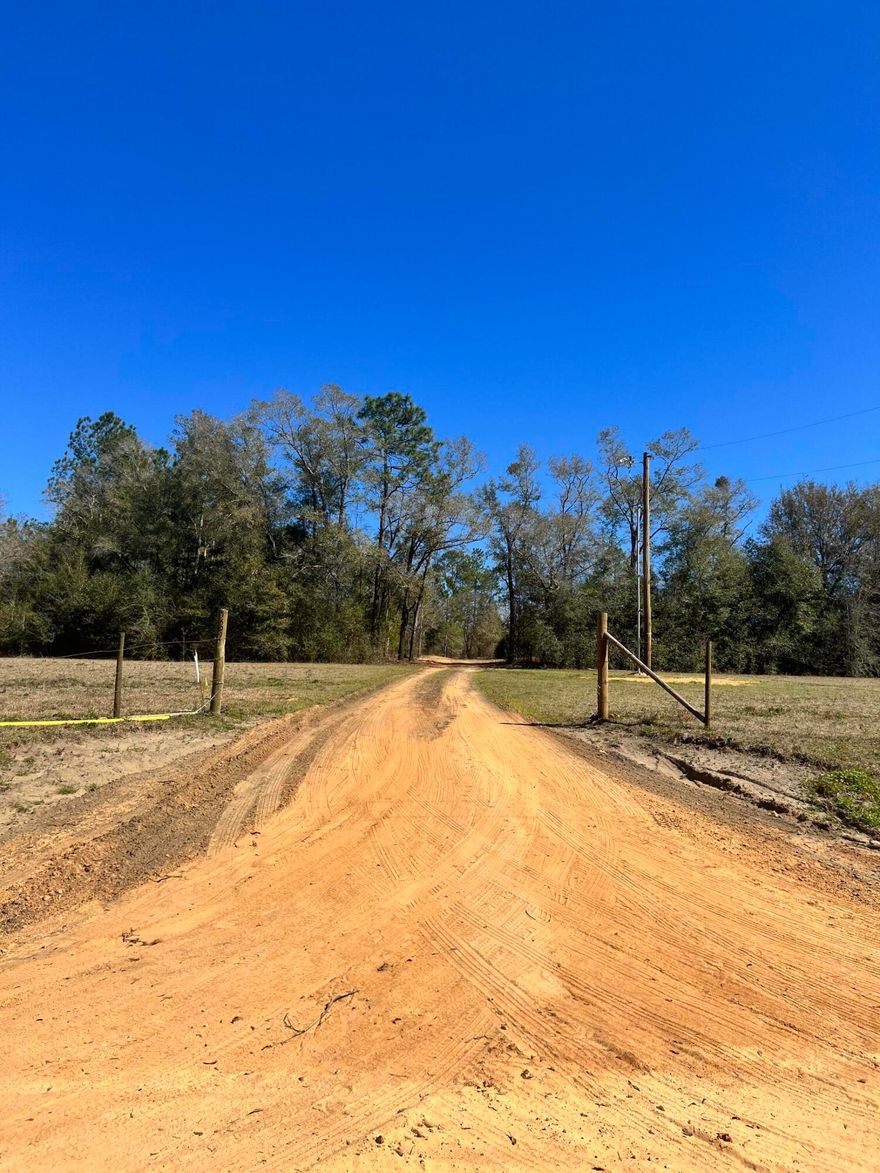 MUST SEE TO BELIEVE!!!  Looking for peace and quiet?  This 14 acres is an amazing property.  It is high & dry with a new septic and underground electrical wiring.  The well is scheduled to be installed. The brand new pole barn will house a 5th wheeler, boats, cars and much more.  Across from the pole barn is an additional new barn with 24x24 hay loft, stalls, utility room with washer/dryer and is wired for electricity.  This land is partially cleared and ready to build on.  Plans for a 2BR/2b are available for the buyer along with a recent survey. There are no easement issues with this property.