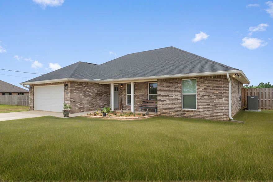 2022 ALL Brick Home on 1.7 Acres with Workshop, Pole Barn, Garden, & More! Country living meets modern comfort in this stunning 2022 all-brick home, perfectly situated on 1.7 acres of flat, cleared land. With a fully fenced backyard, this property is ideal for those seeking space and functionality. Inside, you'll find a spacious 3 bedroom, 2 bath layout with a desirable open and split floor plan. Durable LVP flooring runs throughout the main living areas, with carpet in the bedrooms for added comfort. The wide-open living room flows seamlessly into the dining area and a well-appointed kitchen featuring granite countertops, ample storage, a pantry, stainless steel appliances (just two years old), and an upgraded gas oven--perfect for home chefs. The private master suite is thoughtfully separated from the other bedrooms and offers a luxurious en-suite bath with a huge walk-in shower, dual vanities, and two walk-in closets. The additional bedrooms are generously sized and share a well-designed full bath. Step outside to enjoy the expansive 30x12 covered back porchan ideal space for relaxing, grilling, and enjoying views of your large backyard. The property includes a 35x30 workshop with insulated ceilings, power and water, and a 35x15 pole barn, perfect for RV or boat parking. A maturing garden with corn and beans is already underway, and the cross-fenced backyard setup makes it ideal for keeping small farm animals like chickens or goats. This home is serviced by a private water well but also has access to public water. Whether you're a first-time buyer, a family needing more space, or someone who values having room for hobbies and outdoor living, this property has it all. Schedule your showing today and discover the perfect blend of rural charm and modern amenities.