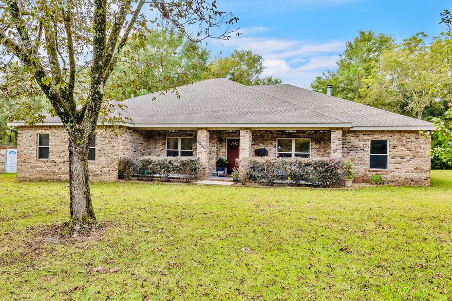 Discover small-town charm fused with modern ease in this custom home on a full acre in Baker, FL. Savor quiet, semi-rural living minutes from I-10 and the Panhandle's outdoor playgrounds. Hike, kayak, or camp in Blackwater River State Forest, relax at nearby springs and rivers, or bask on world-class beaches--adventure is always at hand. Crafted for daily comfort and effortless entertaining, the home showcases an open, flexible plan, 9' ceilings, and durable porcelain tile throughout. A rocking-chair front porch invites you into a sunlit foyer and private office for remote work. The generous living room seamlessly joins the dining area and chef's kitchen, creating one welcoming gathering space. A yard building with 220-volt power is perfect for hobbies, storage, or RV hookup. Welcome to small-town charm with modern comfort. This custom-built home on a full acre in Baker, Florida offers the best of both worldspeaceful, semi-rural living with quick access to I-10 and all the natural beauty the Florida Panhandle is known for. Baker is a community where neighbors know each other, life slows down, and outdoor adventures are right at your doorstep. From Blackwater River State Forest's hiking, kayaking, and camping, to nearby springs, rivers, and world-class beaches, you'll never run out of ways to explore. Designed with both everyday living and entertaining in mind, this home features an open, versatile floor plan with 9' ceilings and porcelain floors throughout. A welcoming front porch leads you inside to a bright foyer and private office. The spacious living room, complete with a wood-burning fireplace (gas option) and custom built-ins, flows seamlessly to a gourmet kitchen boasting a gas cooktop with hood vent, double ovens, granite counters, abundant cabinetry, and a large walk-in pantry. The breakfast bar seats eight, and the breakfast nook offers serene backyard views. The primary suite is a true retreat with room for a sitting area, two walk-in closets with custom inserts, and a spa-like bath featuring dual vanities, dressing area, deluxe tiled shower with triple shower heads, and water closet. Two additional bedrooms include generous walk-in closets; one has an ensuite bath, and another full bath offers a jetted tub. A flexible craft/dining room, oversized laundry with utility sink, and 2-car garage add even more convenience. Step outside to a covered back porch overlooking nature and wildlife. With gas hookups for an outdoor kitchen, wiring for a whole-house generator, and pre-plumbing for a pool, this home is ready for future upgrades. A yard building with 220-volt power is perfect for hobbies, storage, or RV hookup. Come experience the quiet luxury of Baker livingspace, comfort, and connection to both community and nature.