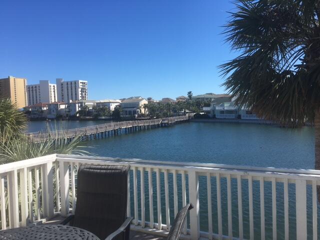 VERY NICE 2BR 2 1/2 BA LAKEFRONT CONDO IN SOUTHBAY BY THE GULF. A WELL ESTABLISHED CHARMING 109 UNIT COMPLEX IN MIDDLE OF DESTIN ON 14 LANDSCAPED ACRES FROM SOUTHSIDE OF HIWY 98 TO THE GULF OF MEXICO. CONDO COMES FULLY FURNISHED AND CAN DO $30000 IN GROSS RENTALS. KITCHEN HAS RECENTLY BEEN REMODELED WITH UPGRADED FLOORING, LIGHTING, CABINETS, GRANITE COUNTERS, TILE BACKSPLASH AND S/S APPLIANCES. TWO SPACIOUS DECKS OVERLOOKING DUNES OF DESTIN LAKE ADD 200 SQ FT OF OUTDOOR LIVING SPACE. YOU CAN FISH OFF BOTH DECKS OR ENJOY THE PRISTINE WATER VIEWS. SHORT WALK TO THE 300' OF PRIVATE WHITE SAND BEACH. PROPERTY HAS TWO POOLS, ONE HEATED, TWO KIDDIE POOLS, PICNIC AREA, CLUBROOM, TWO LIGHTED TENNIS COURTS AND SHUFFLEBOARD, A FAMILY ORIENTED PET FRIENDLY PROPERTY.
