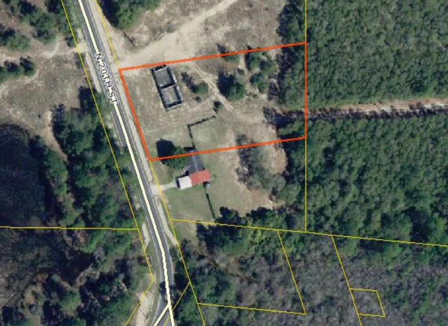 This 1.46 acre parcel is located just north of Hwy 90 in DeFuniak Springs. Zoning is R-2 Multi-Family with public sewer and water available. All measurements to be verified by buyer.
