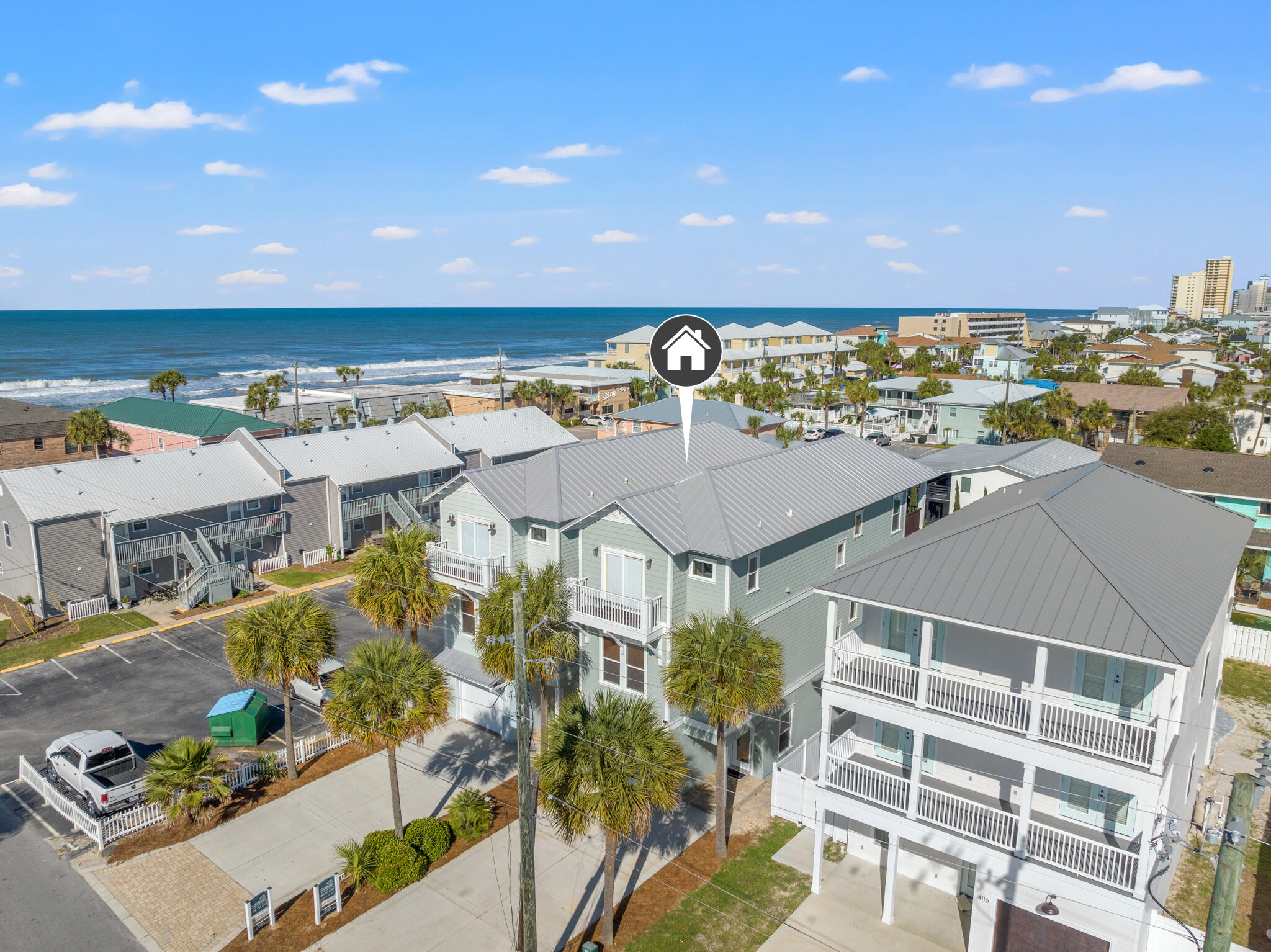 LOCATION! LOCATION! Beautiful 4 bedroom/4 bath home located in popular Panama City Beach! Owners and guests are just steps to the powdered sugar beaches as well as locally owned restaurants and bars. This house is part of a package deal. The adjacent twin home is currently available for sale as well and provides the ability to own two passive income-producing rentals with shared amenities. Or imagine living in one and renting the other. Envision your perfect snowbird home and have the ability to rent the home next door so that you never miss out on income. These homes are perfect for multiple families or friends vacationing together, reunions, bike enthusiasts, destination weddings, sports team families coming to PCB for tournaments, as well as golfers. Imagine two retired besties living next door to each other! An added benefit is having no HOA! The open-concept layout seamlessly connects the living, dining, and kitchen areas, creating an inviting space for both relaxation and entertainment. Whip up delicious meals in the beautiful kitchen, equipped with stainless steel appliances, while enjoying the company of friends and family. Four sizeable bedrooms, each with its ensuite bath providing ample space for privacy and rest. Large patios/decks off the bedrooms provide a tranquil spot for morning coffee or beverage of your choice in the evenings. Enjoy awesome gulf views from the third-floor decks. One of the most inviting features of this home is the outdoor oasis with swaying palm trees and tropical plants that lead to a 14'x36' gunite pool complete with a generous tanning deck. This is a rare opportunity to own two beautiful income-producing homes next door to each other. Fully furnished and already on a rental program - the transition can be seamless. Don't let this rare opportunity slip away!