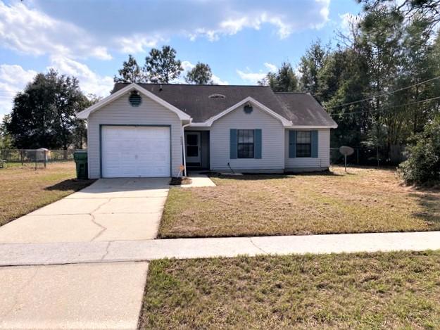GREAT LOCATION SOUTH OF I-10!! Freshly painted interior and all new carpeting. Three bedrooms and two baths. Bay window in breakfast room and also a treyed ceiling. Tile in kitchen and baths. Cathedral ceiling in the Great Room. One car garage. Large lot with fenced back yard. Public sewer so no septic tank!