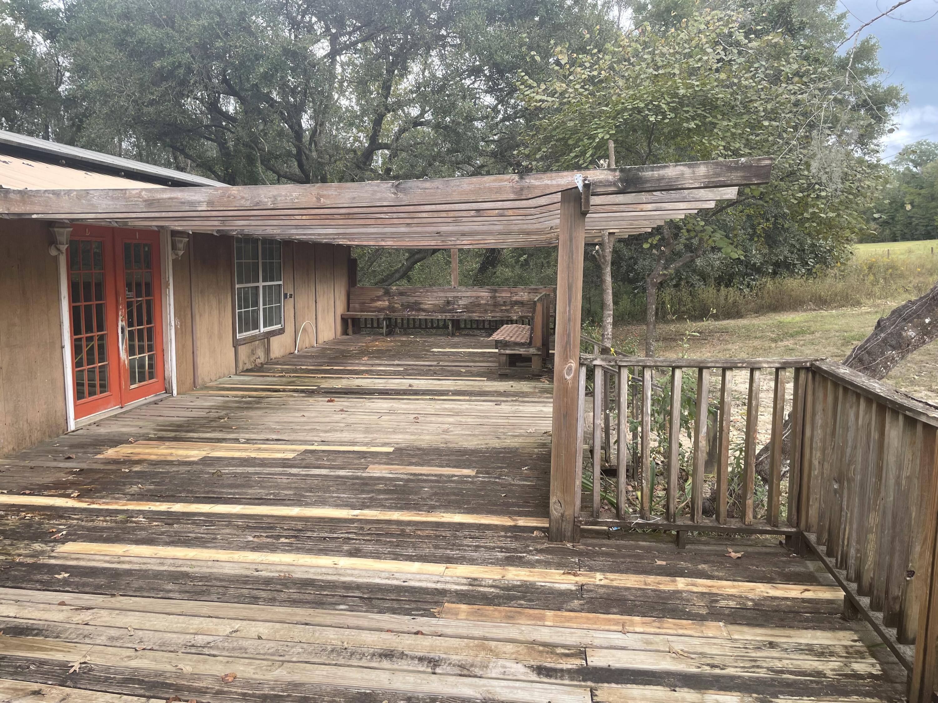 Real Estate Owned, you can have the best of both worlds convenient to Interstate 10 exit approximately 5 miles away with this home sitting on over 30 plus acres included enjoy the tranquility of the country. Located less than an hour from the award winning beaches. Lots of room with a covered back deck, front deck with sitting area. This 4 bed 3 bath includes over 2300 sq ft built in 1989. Large spacious pantry just off the kitchen.  Lot dimensions taken from tax rolls. Lot size and house dimensions t be verified by buyer.  If you need more space this is the place this property sits close to the Choctawhatchee river water management area that offers large floodplain forest boat launches & fishing, plus camping, hiking & seasonal hunting. Call to take a look at 1604 River rd today.