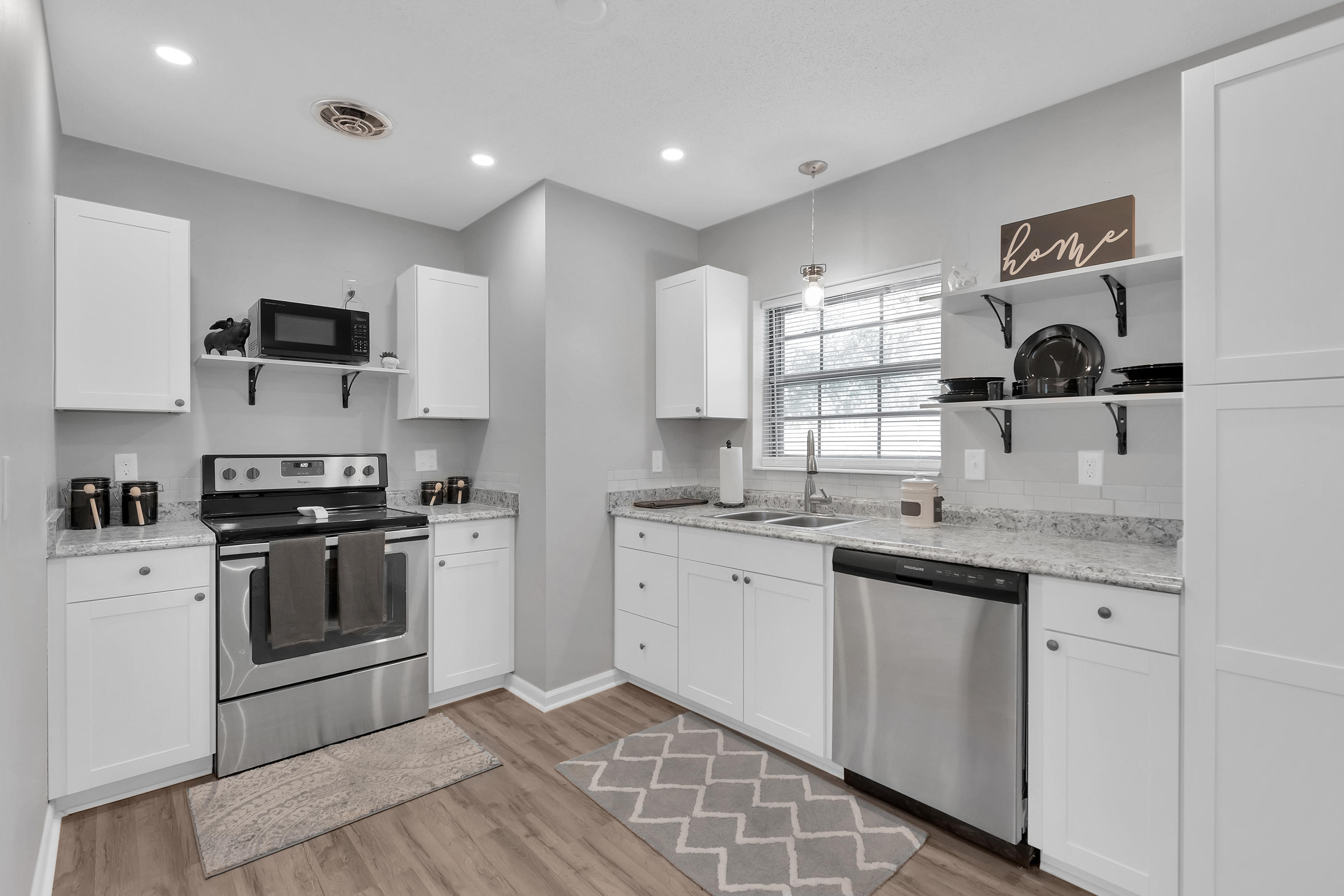 This charming home has been completely remodeled from top to bottom. If you are looking for a home that is ready for you to move your things right in than look no further. Enjoy decorating the front room for the holidays . Spending time with your family in the completely new kitchen. Cozy up to the fire place in the great room to relaxing after a long day . Enjoy a bath or a relaxing showing in the remolded bathrooms .This beautiful home has all new flooring though out, paint, roof, electrical, hot water heater, kitchen, exterior doors and interior doors bathroom, etc... It also has a brand new 6 foot privacy fence with it's own puppy area .