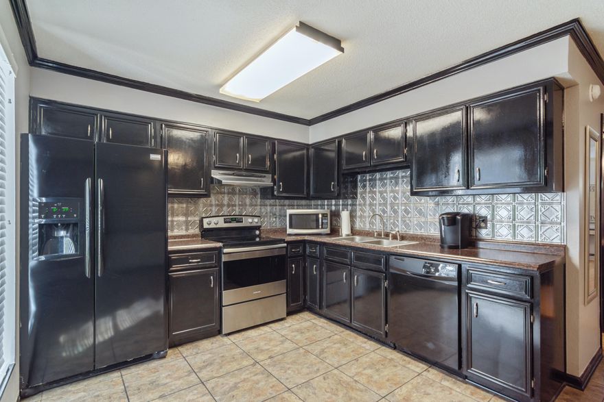 TAKING BACK UP OFFERS...NO Fault of Seller Pause...Here is Home! Did someone say townhome with 1984 square feet, 3 bedrooms, 2.5 bathrooms? Two of the three bedrooms are HUGE, and one of them has an en suite half bathroom. You will also find a third bedroom and full bathroom upstairs. Downstairs you have a living room and converted garage that is heated and cooled for that game room! Hello Home! Yes, come on in to your low maintenance, private rear entry, courtyard. It's all move-in ready for you! Parking in rear with assigned parking spaces totaling 4, and yes, garage can be converted back. Call your favorite Realtor!