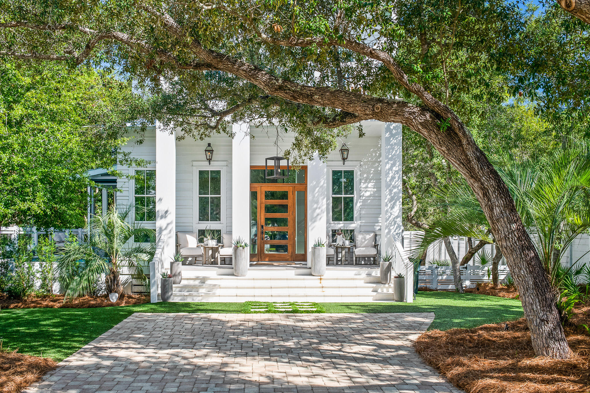 This masterfully crafted residence exudes exemplary coastal charm and is prominently positioned in the heart of Seagrove Beach. With over 3,100 square feet of pristine living space, this 5-bedroom, 4.5 bath home epitomizes 30A living and provides robust short-term rental ability or optimal functionality as a second or primary residence. Desirably situated mere blocks from the beach and presiding over premium canal frontage west of 395, the home has immediate proximity to neighboring Seaside and Watercolor.Entering the home, the open floor-plan and double height ceiling exceeding 14' perfectly accentuate the generous proportions and impeccable design in this incredible residence.