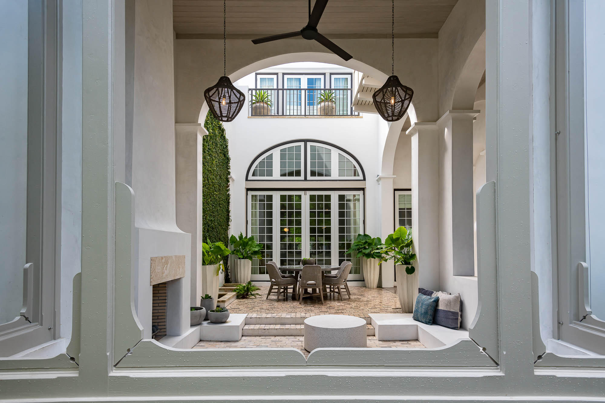 Elegance and drama is at the forefront in this custom designed Khoury Vogt masterpiece overlooking Arboleda Park in Alys Beach. A two-story vaulted loggia with wood burning fireplace flows from the courtyard to the serenity of Arboleda Park. Bi-folding doors seamlessly blend the openness of the living, dining and kitchen with these outdoor areas. Three bedrooms plus a bunk area on the second floor lead to multiple rooftop terraces overlooking the park and the Bermudian whitewashed rooftops of Alys Beach.