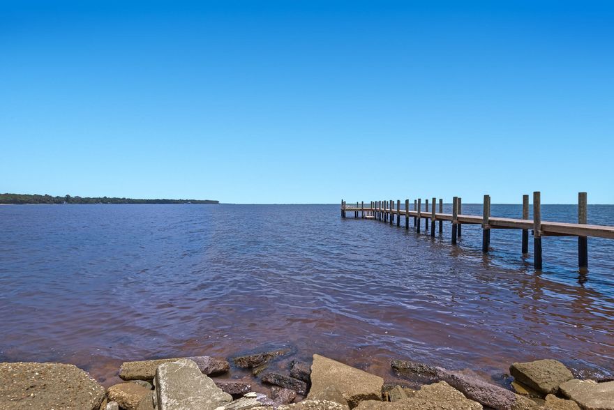 If relaxation and serenity are what you seek...then this is the property for you! This property is hidden just off highway 20 and the views are to-die-for! Direct views of the intercoastal waterway and a great dock are just the stress relief you need to make every day a vacation day! Great living space, one car garage, balcony off the 2nd floor balcony and a sunroom are just a few of the assets it has to offer. This one is a must-see...call today for a closer look.