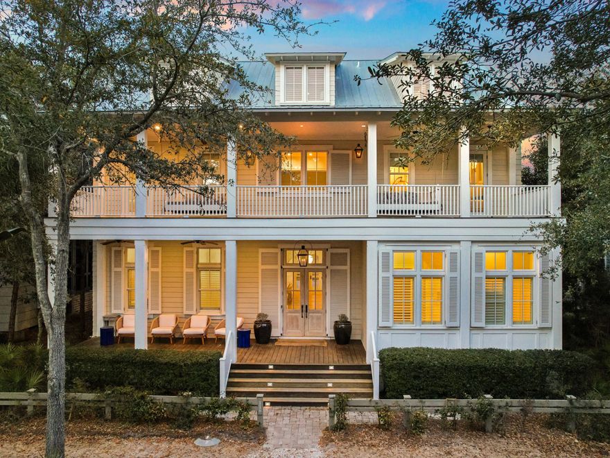 An extraordinary residence in the heart of WaterColor, 116 Wiregrass Way offers more than 5,500 square feet of thoughtfully designed living space with six bedrooms, six full bathrooms, one half bath, and a custom six-bed bunk room. A two-car garage, dedicated golf cart parking, additional guest parking, and a private elevator serving all levels add convenience and ease.Positioned across from a wooded preserve, the home pairs timeless architectural character with modern upgrades designed for comfort, wellness, and effortless entertaining. Upon entry, an arched white Chicago brick foyer, antique oak beams, and a grand staircase introduce the residence's warm coastal elegance. The expansive main living area is anchored by a white brick fireplace and features antique whitewashed wood ceilings, custom millwork, and abundant natural light.
The chef's kitchen is designed for both daily living and entertaining, featuring dual islands, two dishwashers, Wolf and Sub-Zero appliances, a built-in Miele coffee system, and a newly refreshed island countertop. A new Wolf range and oven further enhance the kitchen's performance and functionality.
Significant infrastructure improvements elevate the home well beyond typical expectations. Two HVAC systems have recently been replaced and are complemented by three whole-home Air Scrubbers that enhance indoor air quality. A whole-house water treatment system, paired with an additional point-of-use filtration system, provides purified water throughout the residence.
Technology is seamlessly integrated with enterprise-grade Ubiquiti Wi-Fi delivering strong coverage throughout the home and outdoor spaces. A fully integrated Lutron lighting system allows every light to be controlled through custom scenes, wall keypads, or a mobile device. Sonos audio with six distinct zones provides immersive sound throughout the property. The home is also equipped with a Level 2 Ultium EV charger located on the parking pad.
The first level includes a junior primary suite with a king bed and walk-in closet, a private office, a spacious pantry, and a powder bath. Three sets of handcrafted cypress French doors open to a screened outdoor living room centered around a fireplace. The space features a generous dining area and summer kitchen with a Wolf grill, beverage refrigerator, sink, and ice maker, creating seamless indoor-outdoor living.
Beyond the porch, the private courtyard unfolds as a resort-style retreat with a swimming pool, spa, fountain feature, and multiple lounging areas designed for relaxation and entertaining.
The primary suite serves as a private sanctuary with vaulted beamed ceilings, a sitting area, breakfast bar, and private balcony overlooking the pool. The spa-inspired bath features marble finishes, a soaking tub, and a spacious walk-in closet. The second level also includes three additional guest suites, each with a private balcony and full bath, along with a well-appointed laundry room with custom cabinetry.
The third level provides additional flexibility with a guest suite, secondary living area, and a custom bunk room with six built-in bunks and a full bath, ideal for hosting family and guests.
Residents enjoy access to WaterColor's renowned amenities including six resort-style pools, the recently renovated gulf-front beach club, tennis facilities, a fitness center, scenic trails, the BoatHouse for paddleboarding and kayaking, and Camp WaterColor's lazy river and recreation areas. Set within 499 acres along South Walton's celebrated coastline, 116 Wiregrass Way offers an exceptional opportunity to experience luxury coastal living along 30A.