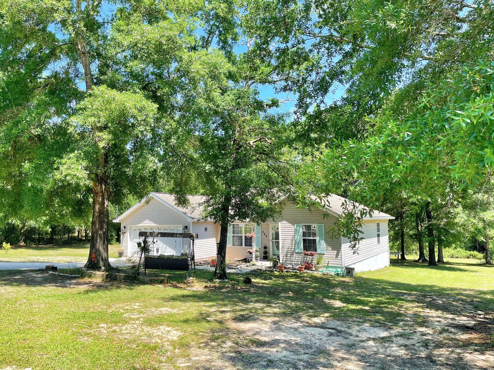 Very well kept 3 bedroom 2 bath house located on over 1 ACRE! Large garage with built in storage. The house has a covered, enclosed back porch (24X10) that overlooks the back yard. Open floor plan with spacious master bedroom and bathroom with vanity sitting area. All new paint through out house and many updates. This house is close to it all! 35 minutes to the beaches of South Walton, just over 30 miles to Eglin Air Force Base. Buyer must verify all measurements to own satisfaction.