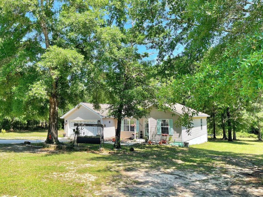Very well kept 3 bedroom 2 bath house located on over 1 ACRE! Large garage with built in storage. The house has a covered, enclosed back porch (24X10) that overlooks the back yard. Open floor plan  with spacious master bedroom and bathroom with vanity sitting area. All new paint through out house and many updates. This house is close to it all! 35 minutes to the beaches of South Walton, just over 30 miles to Eglin Air Force Base. Buyer must verify all measurements to own satisfaction.