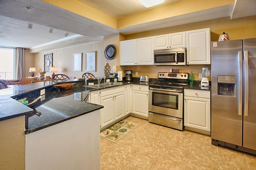 Beautiful 2 bedroom condo at one of the best rental condos on the beach. 33k in rental income for 2014 and completely booked through Mid August with winter guests already in place! SELLERS WILL HAND OVER FUTURE BOOKINGS! This gorgeous condo is basically 2 years old. Sellers bought unfurnished in 2012 and completely updated with new carpet, paint, crown molding...top to bottom!! The ''A'' floorplan at Tidewater is one of the largest 2 bedrooms on the beach, measuring almost 1600 square feet! Other features include walk in closet in master bedroom, walk in laundry room and interior storage closet! This floorplan has always been one of the most popular 2 bedrooms in Panama City Beach and can accommodate long term living as well as vacation rentals! Sellers say ''BRING OFFERS''