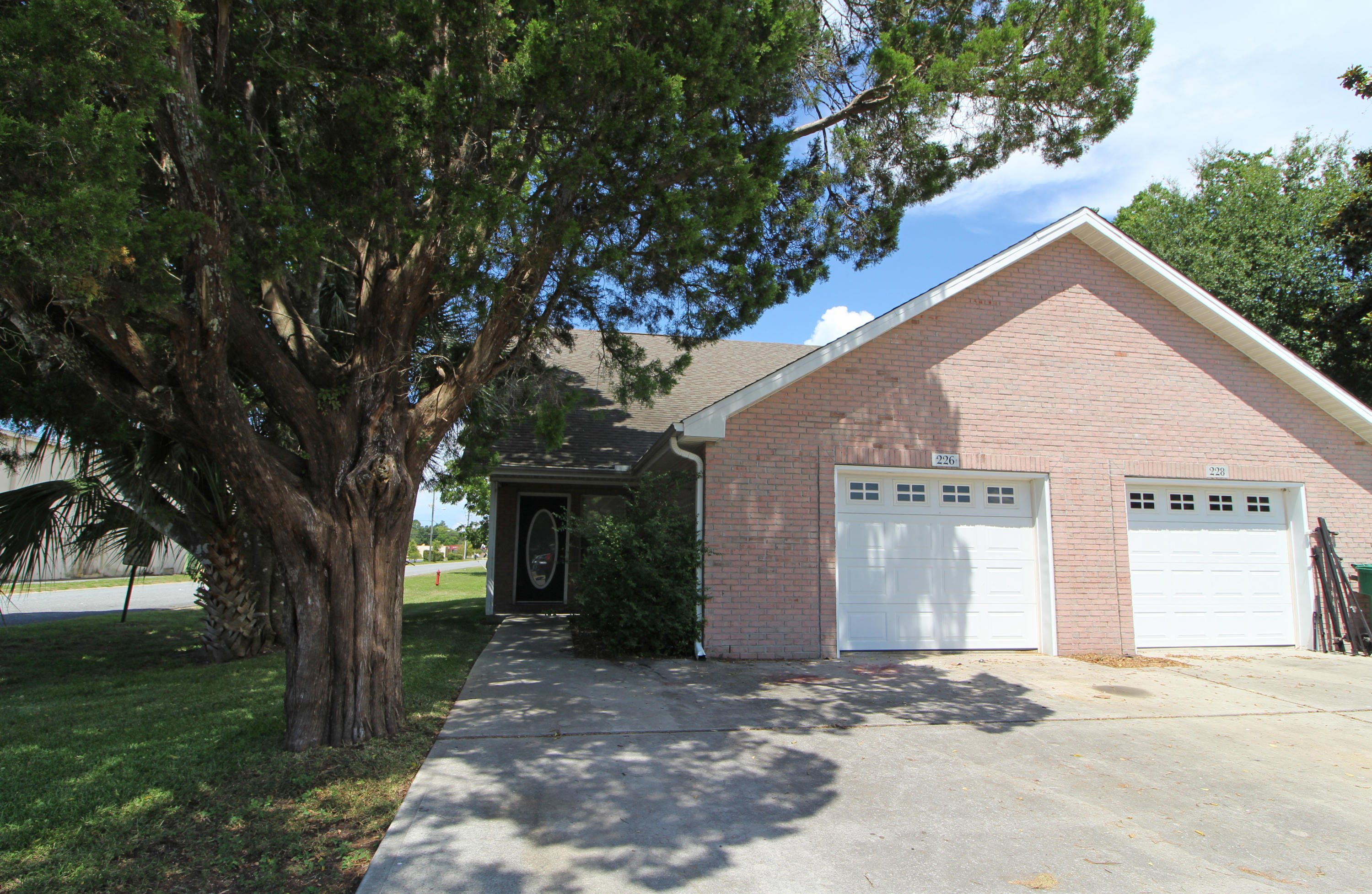 WHY RENT WHEN YOU CAN BUY THIS TOWNHOME SITUATED IN THE HEART OF FORT WALTON BEACH! Spacious living area with high vaulted ceilings and 2'' faux blinds. Dining area is open to the living area. Kitchen has plenty of cabinetry and counterspace, pantry, breakfast bar and a door that leads out to the patio. Extra storage under the stairs. Master bedroom downstairs and a full bath with access from the hall way. Upstairs has a small landing area, two good-size bedrooms and a full bath. Oversize one car garage complete with a washer and dryer. Low maintenance exterior and no yard work-The association fees include lawn care. Close to shopping, restaurants, banking, both Eglin AFB and Hurlburt AFB, beaches and downtown Fort Walton Beach. Call today to take a look inside. Move in READY!!